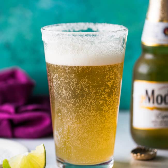 A Mexican chelada in a pint glass ready to drink.