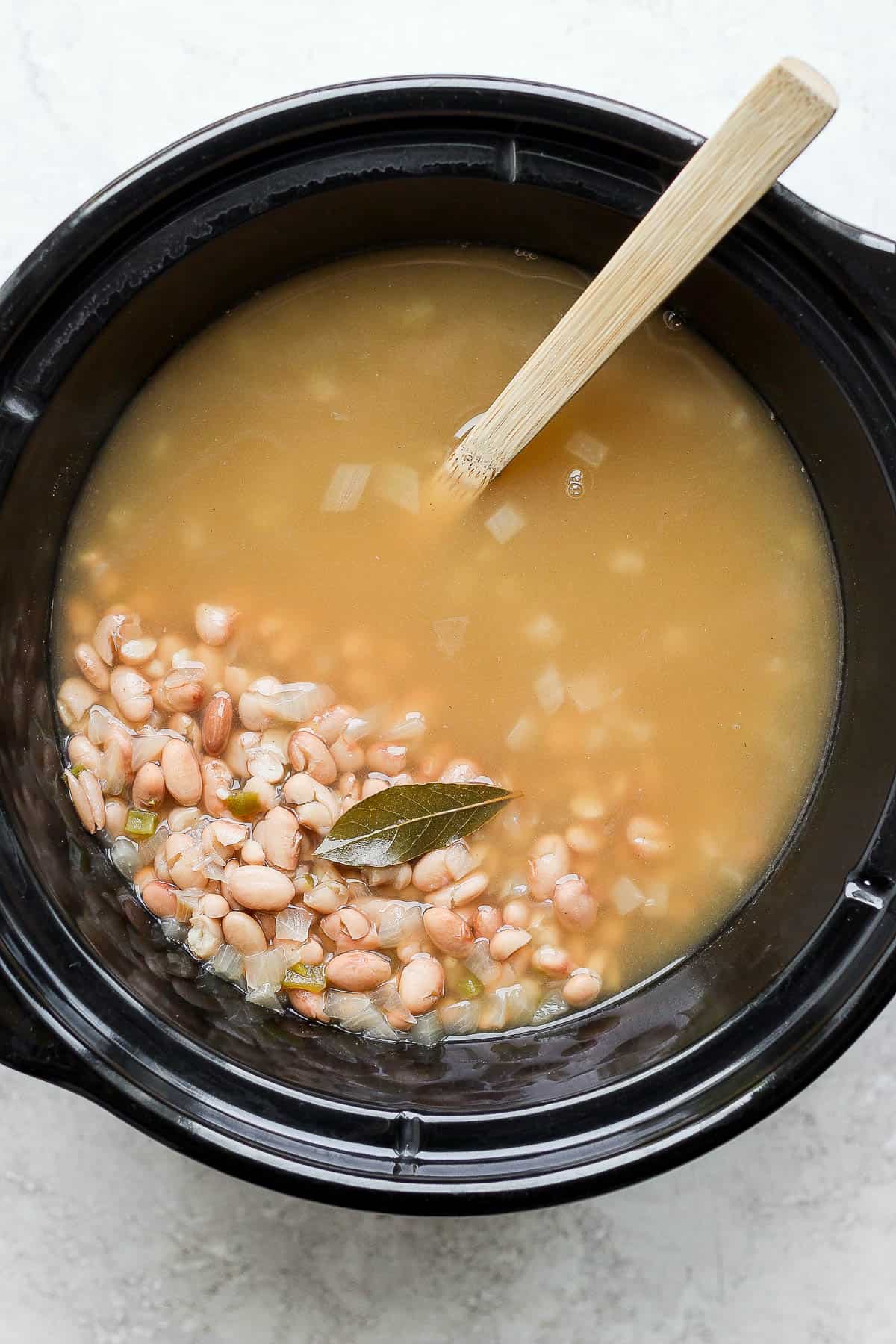 Cooked crock pot pinto beans ready to serve.