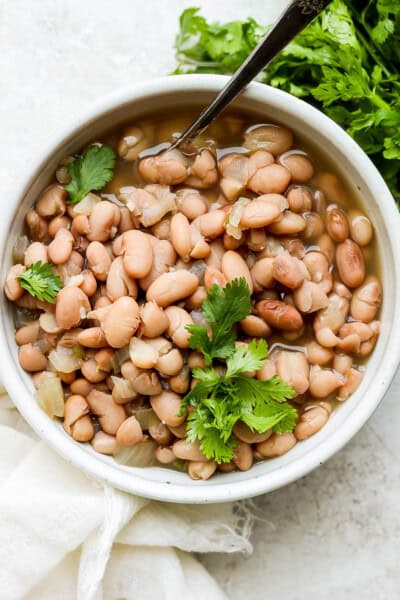 Crock pot pinto beans in a bowl.