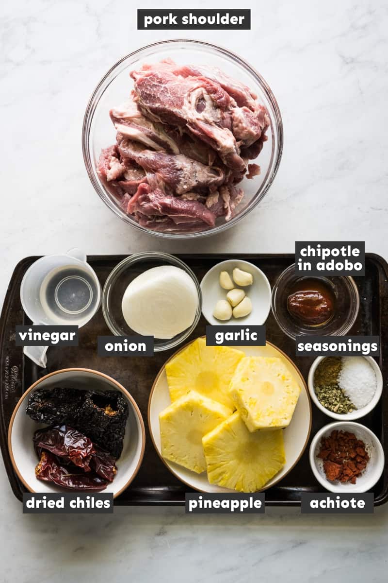 Ingredients in tacos al pastor on a table.