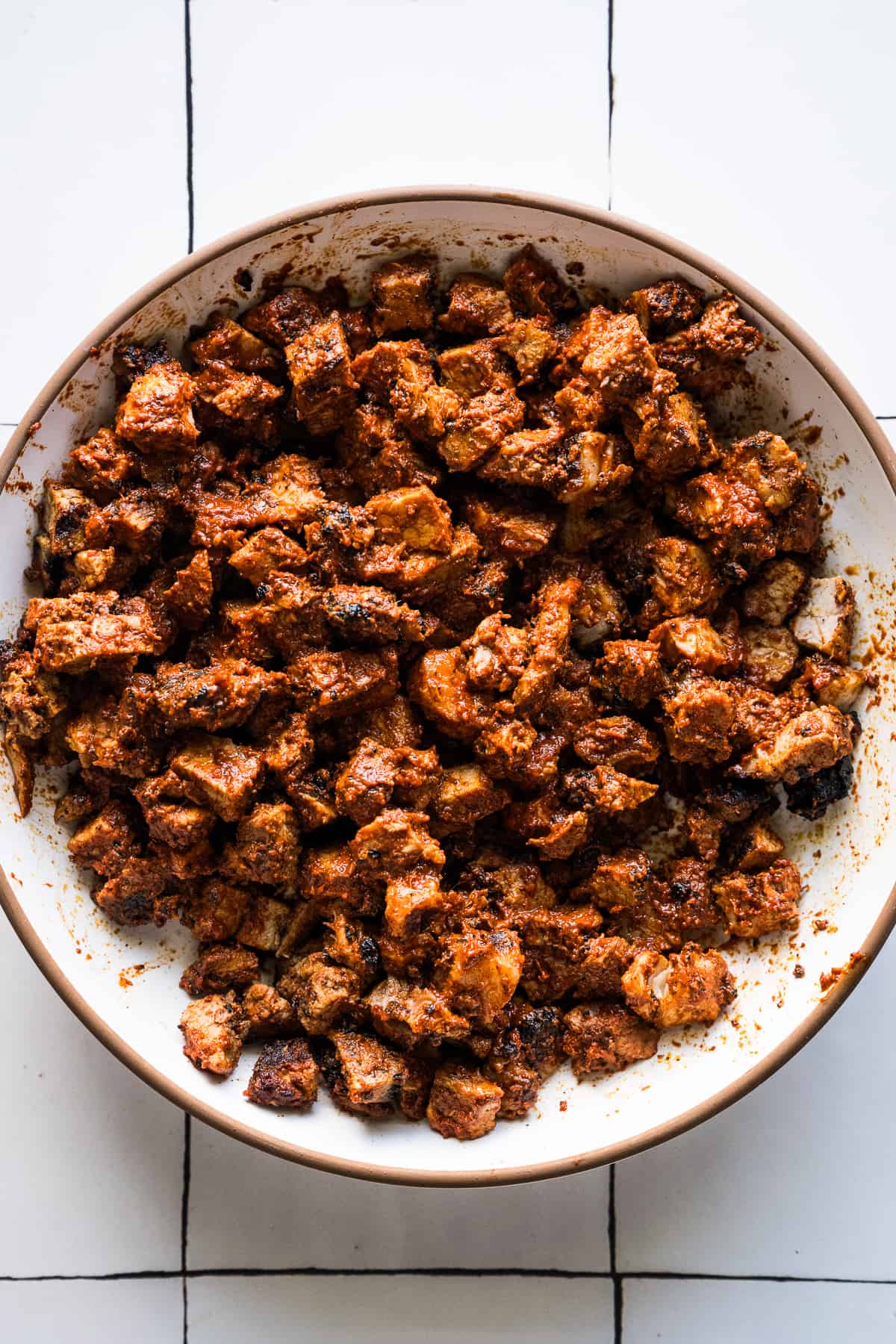 Diced tacos al pastor meat ready to eat in a bowl.