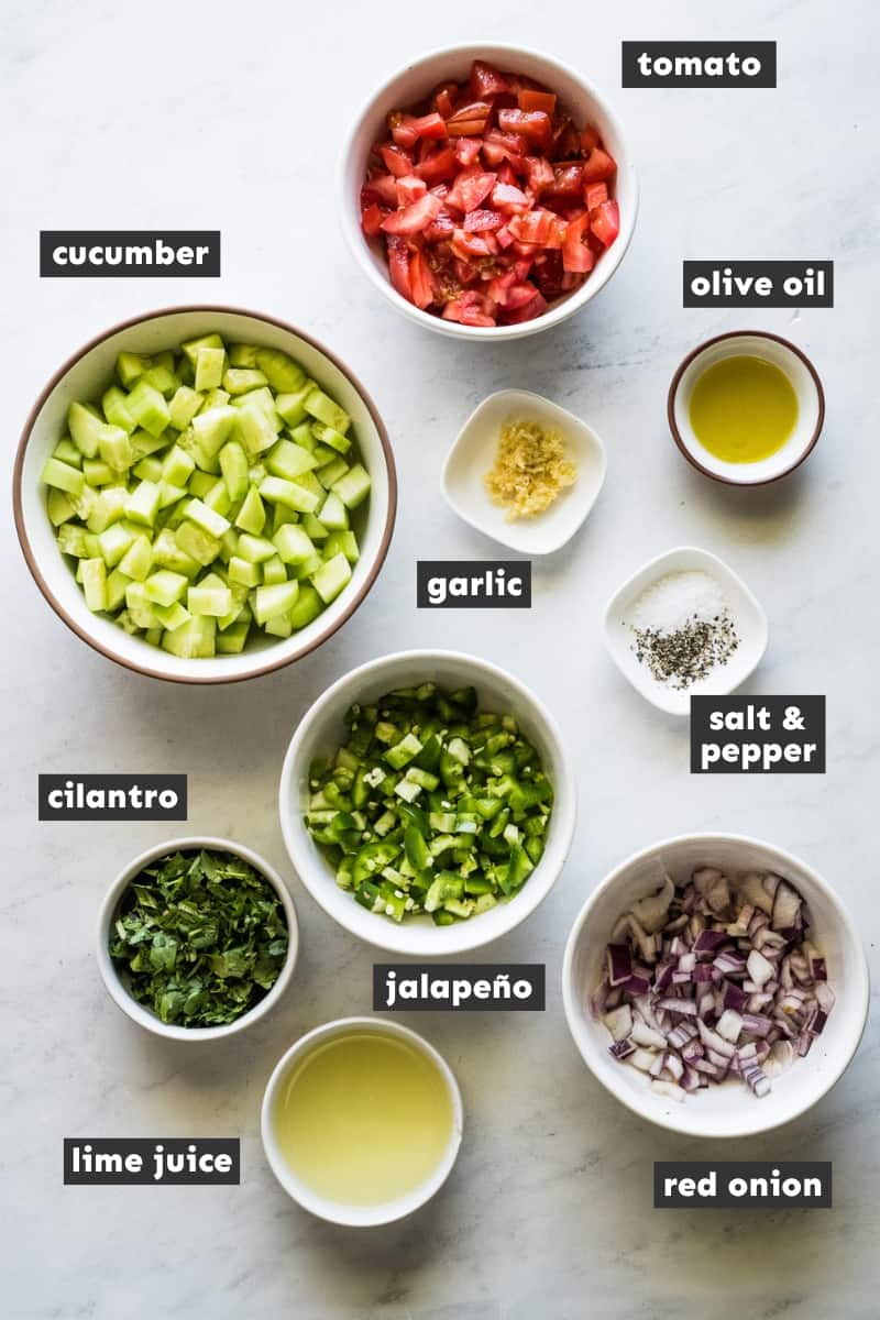 Cucumber salsa ingredients on a table.