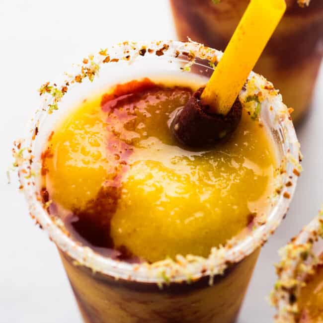 A Mexican mangonada with a tamarind candy straw.