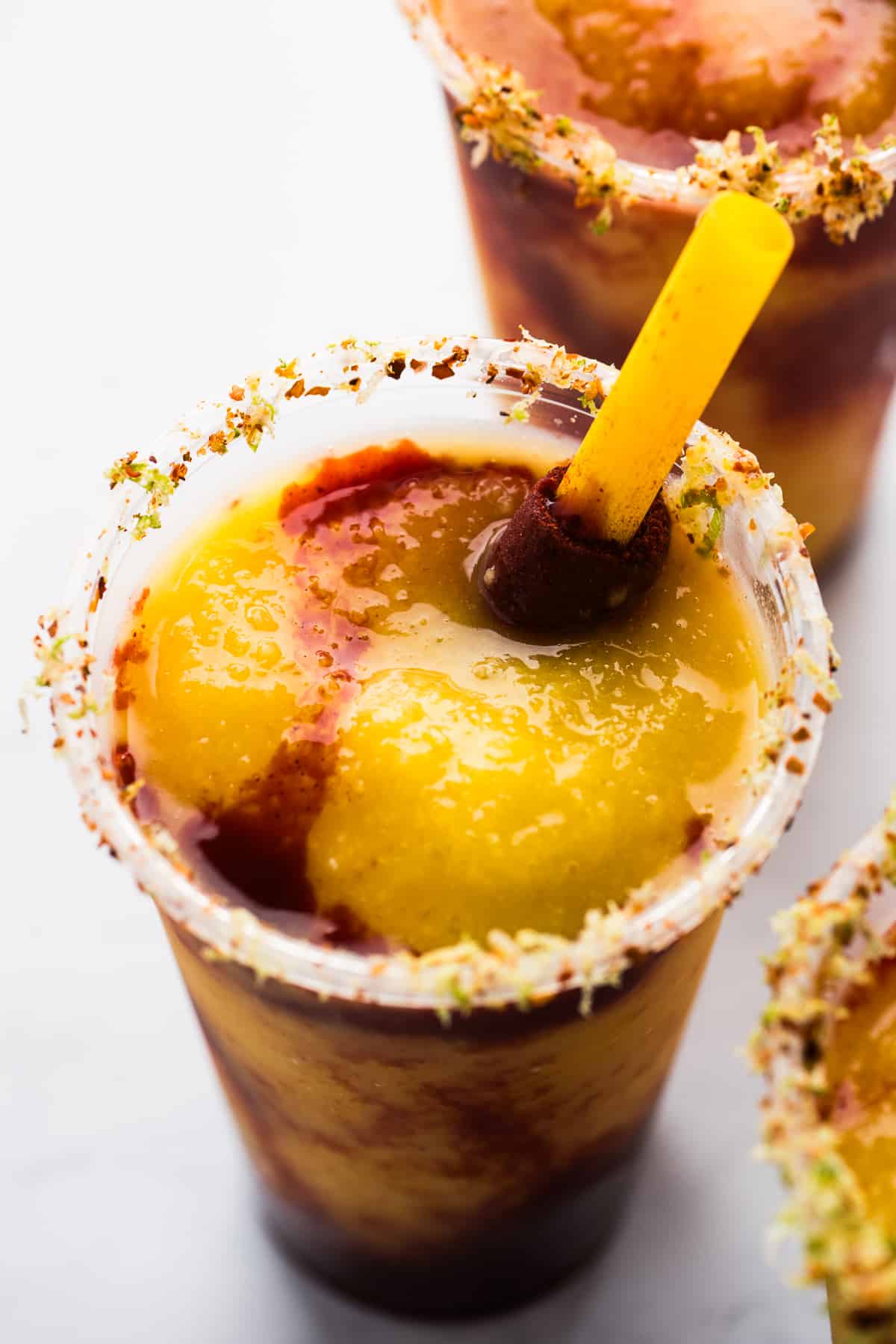 A Mexican mangonada with a tamarind candy straw.