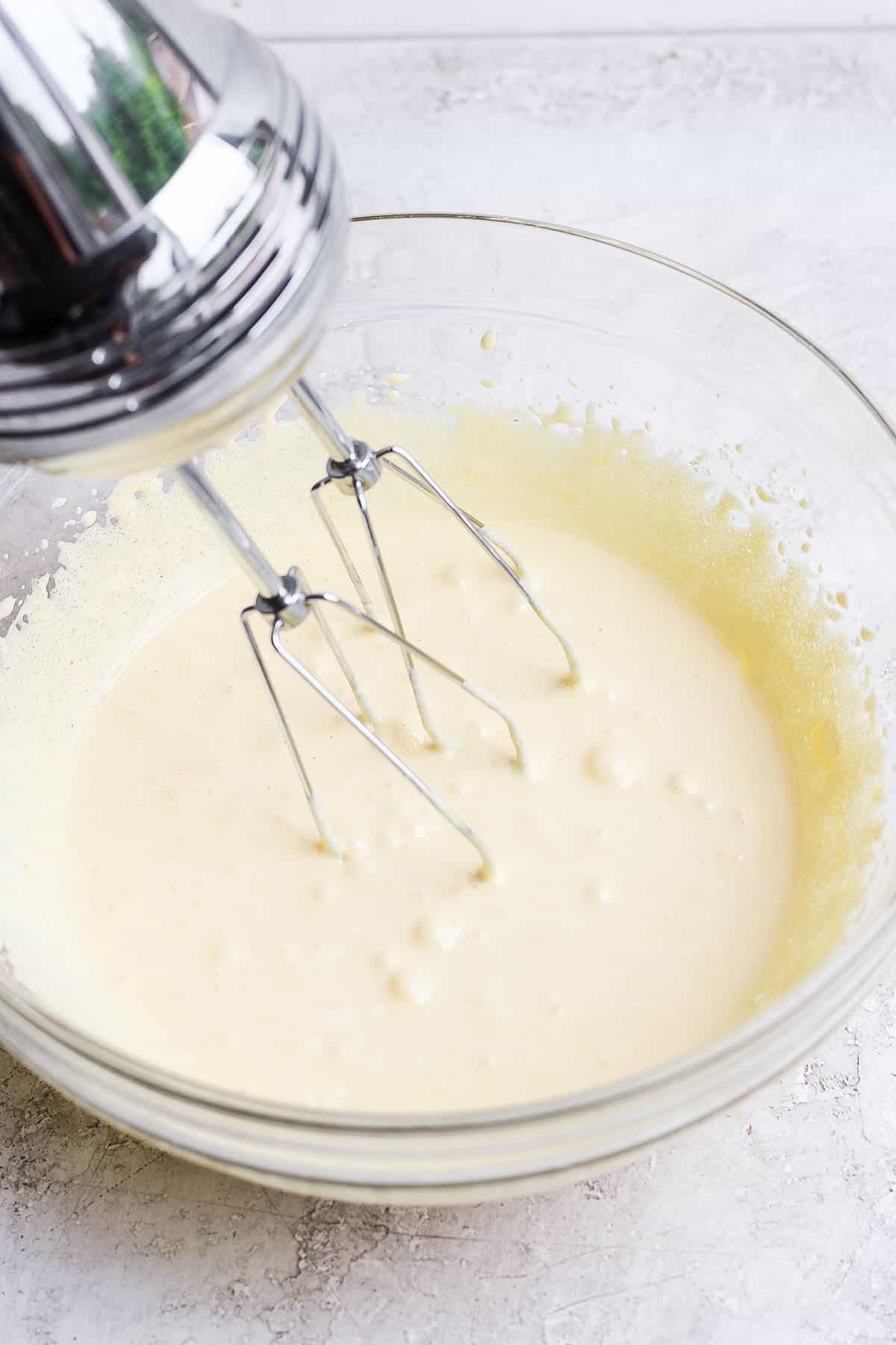 Part of the tres leches cake batter mixed in a bowl