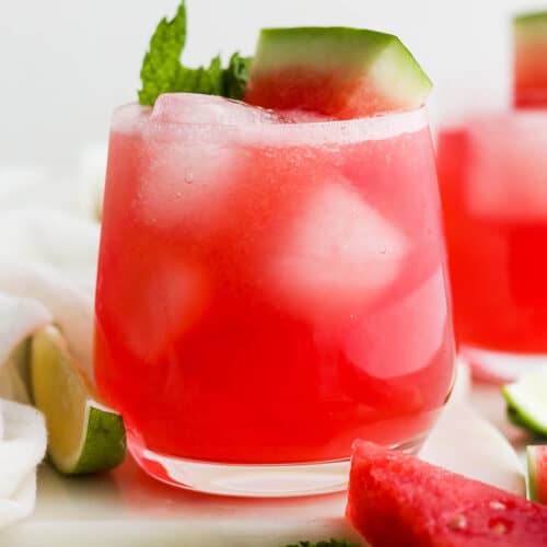 Watermelon agua fresca (agua de sandia) in a glass with ice cubes.