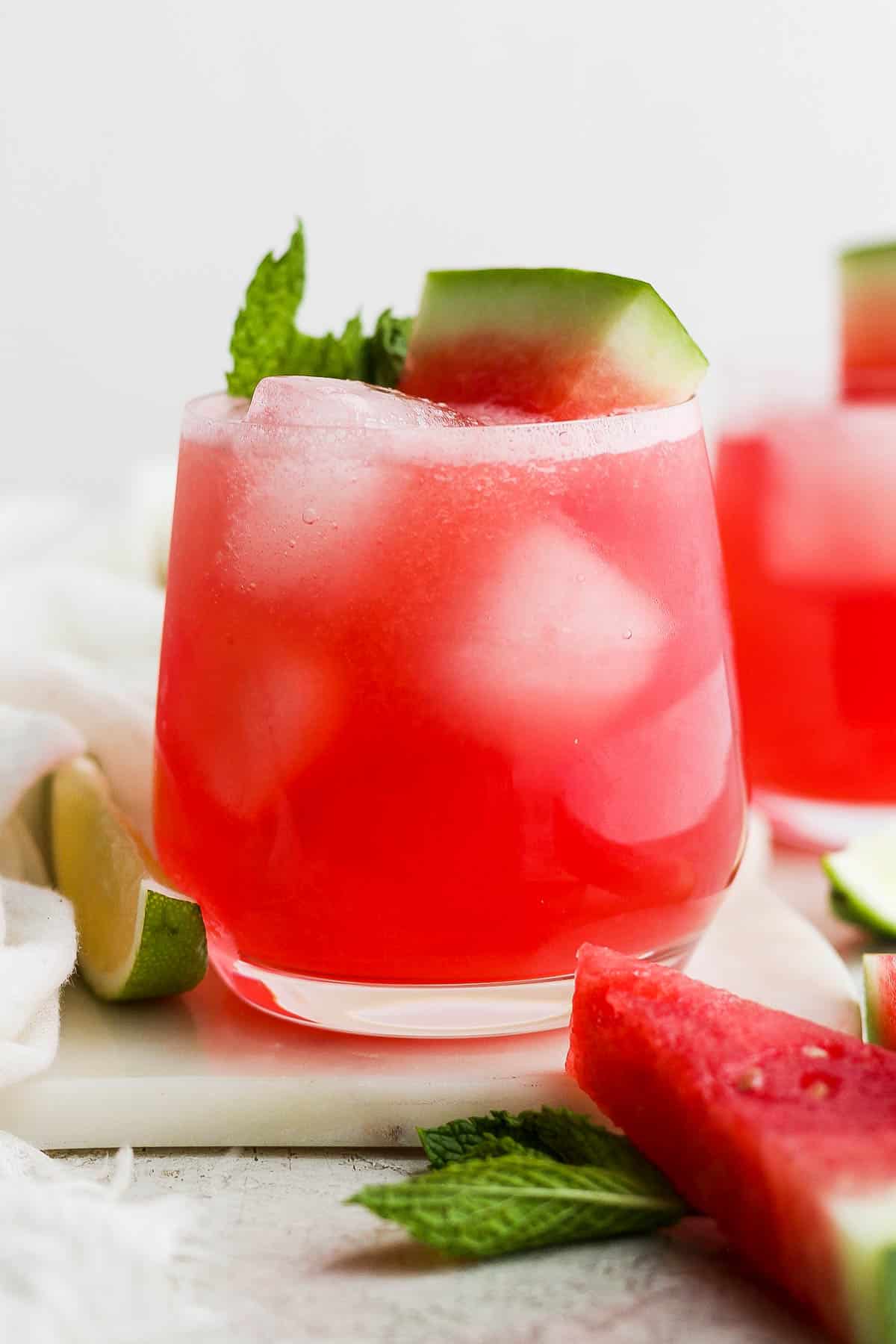 Watermelon agua fresca (agua de sandia) in a glass with ice cubes.