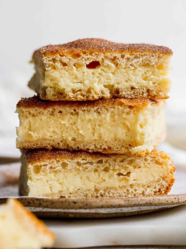Sopapilla Cheesecake stacked on top of one another.