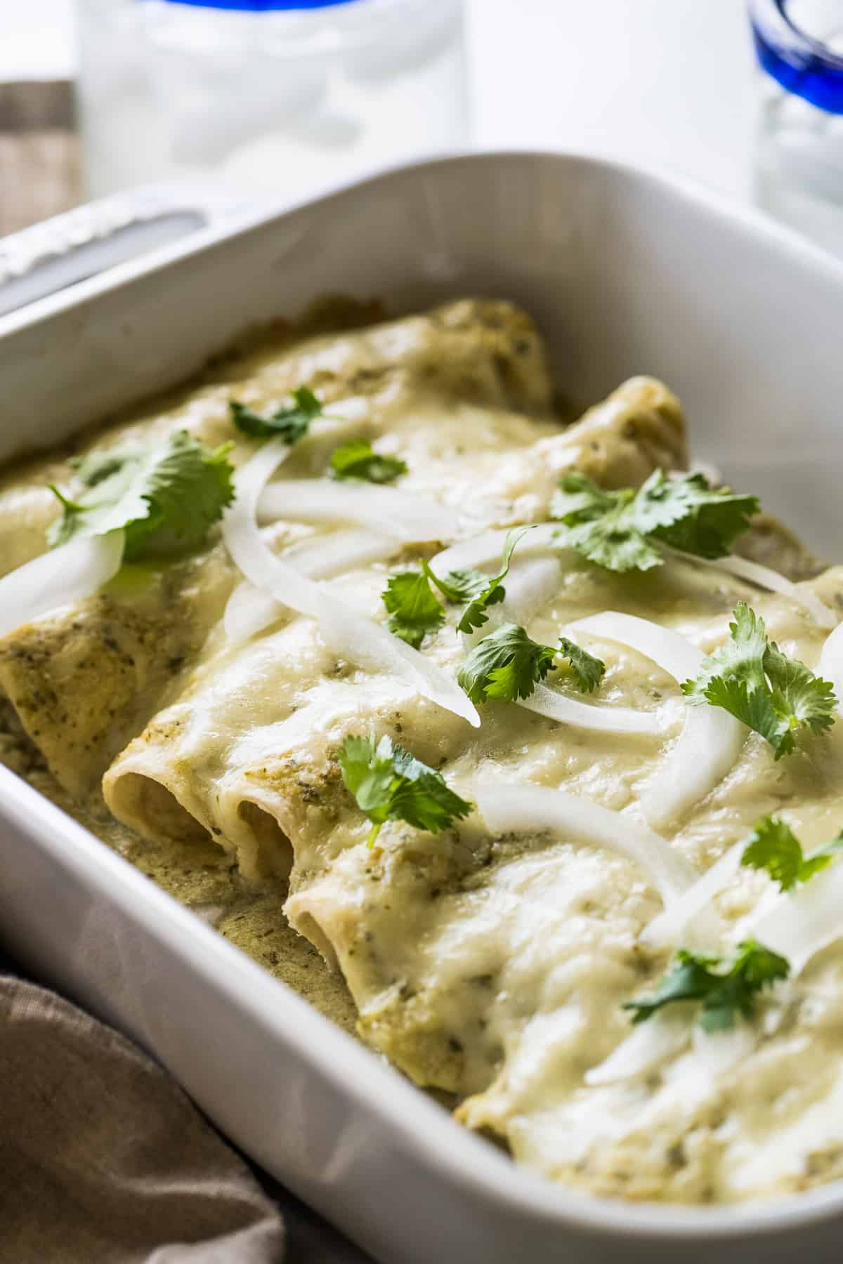 Enchiladas suizas in a baking dish.