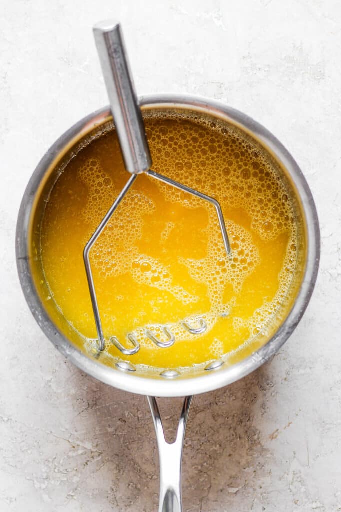 Mango syrup in a saucepan for raspados