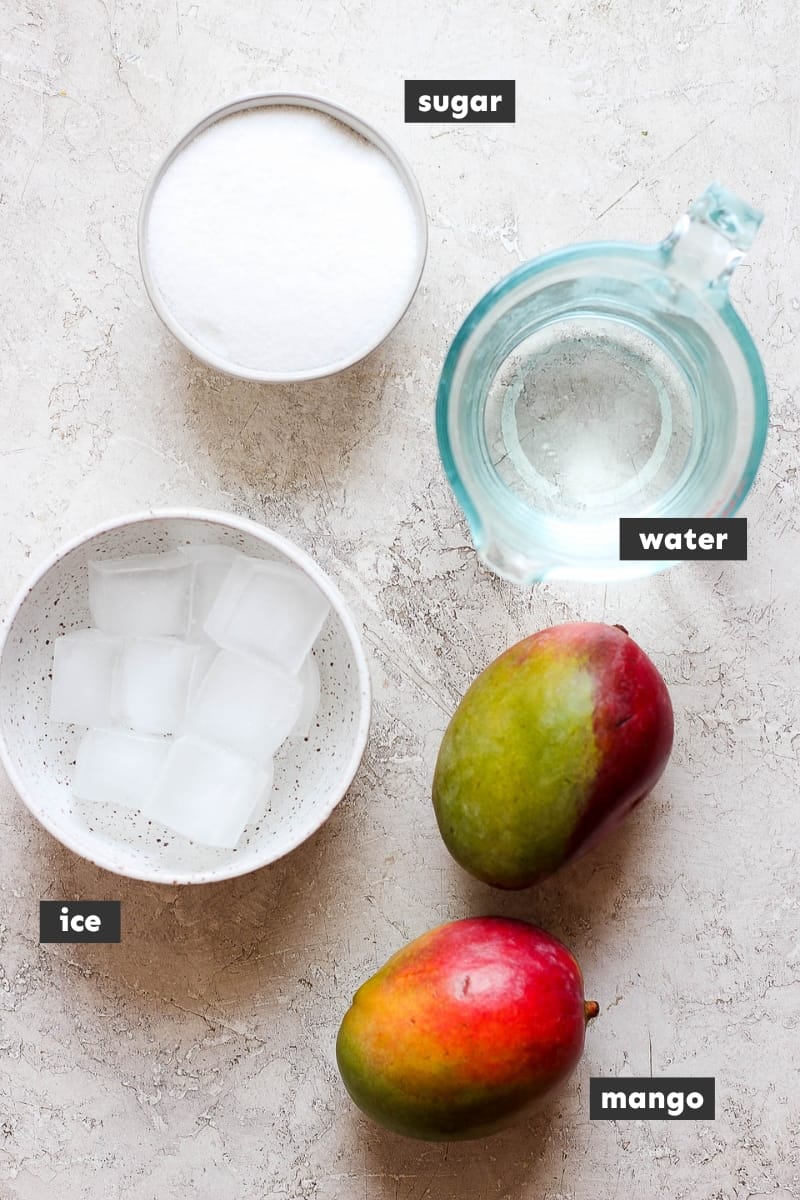 Ingredients for mango raspados on a table