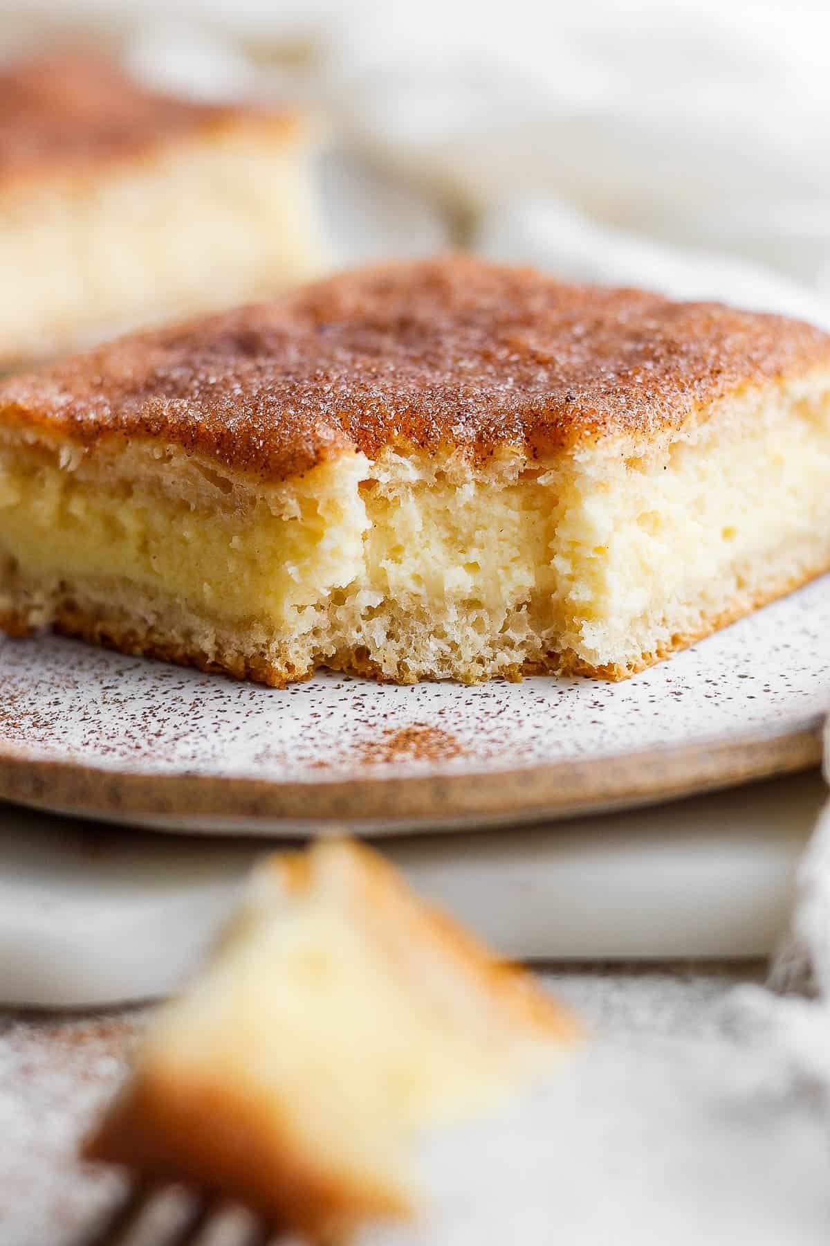 Sopapilla cheesecake on a plate.