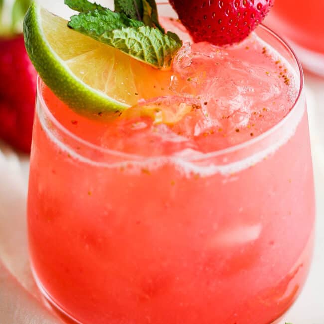 Agua de fresa (strawberry agua fresca) in a glass with ice