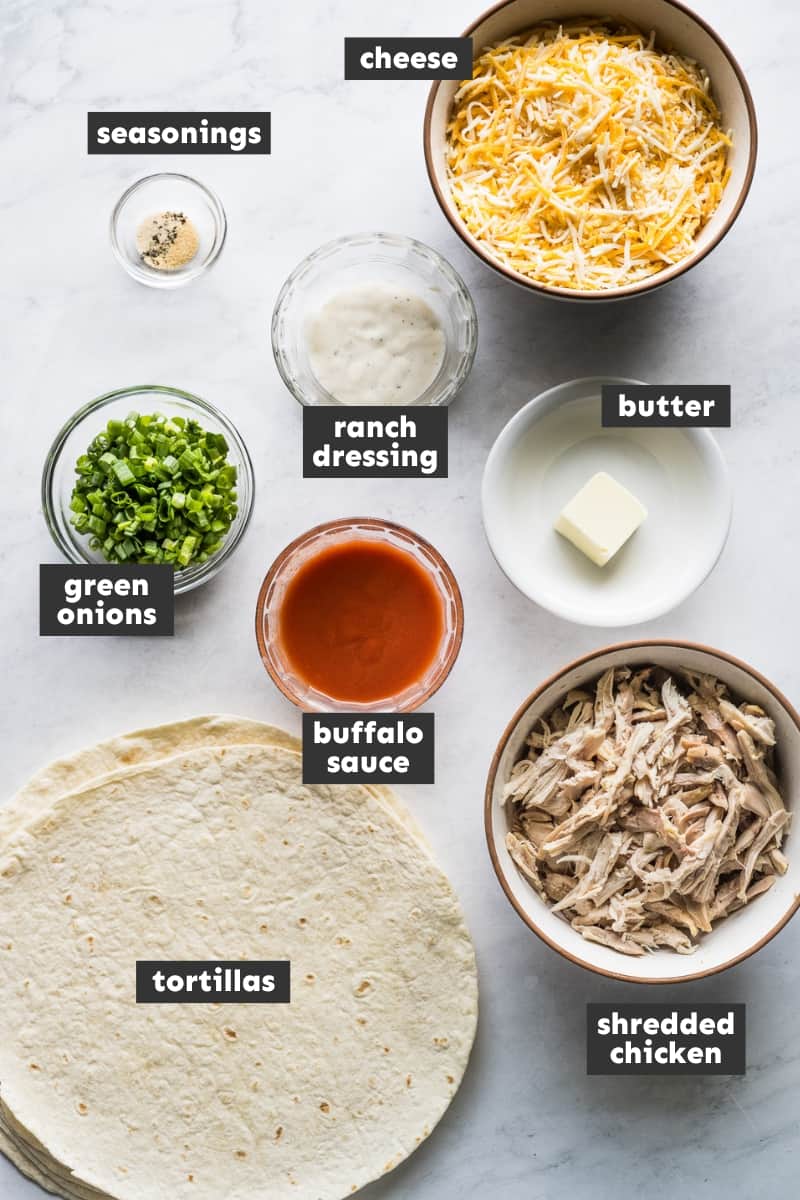 Buffalo chicken quesadillas ingredients on a table