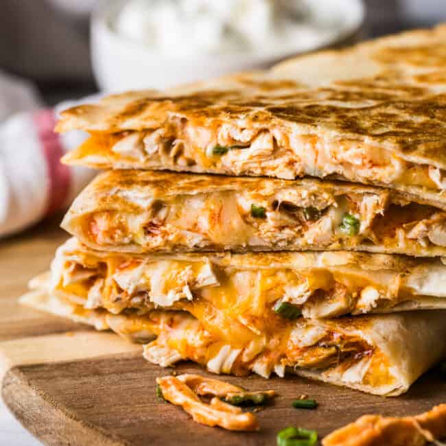 Buffalo chicken quesadillas stacked on top of one another.