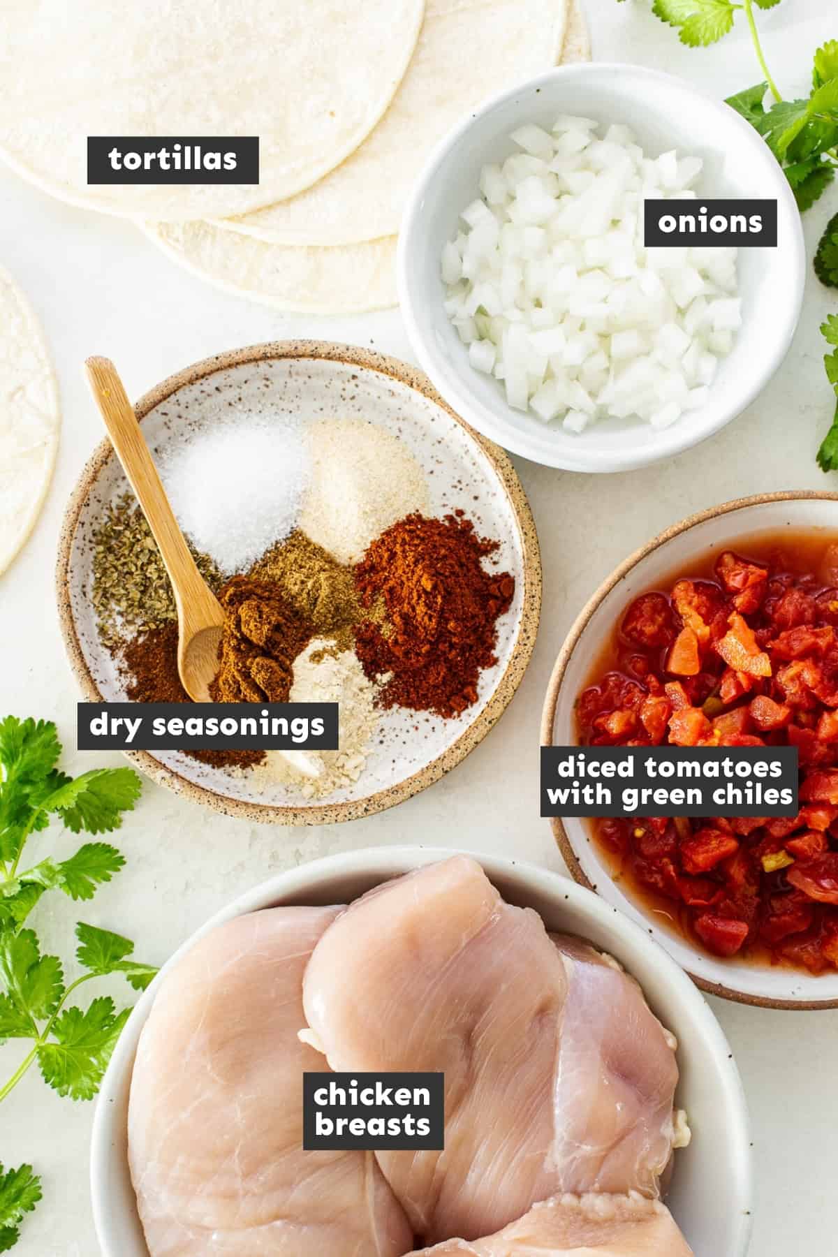 Ingredients for crockpot chicken tacos on a table.