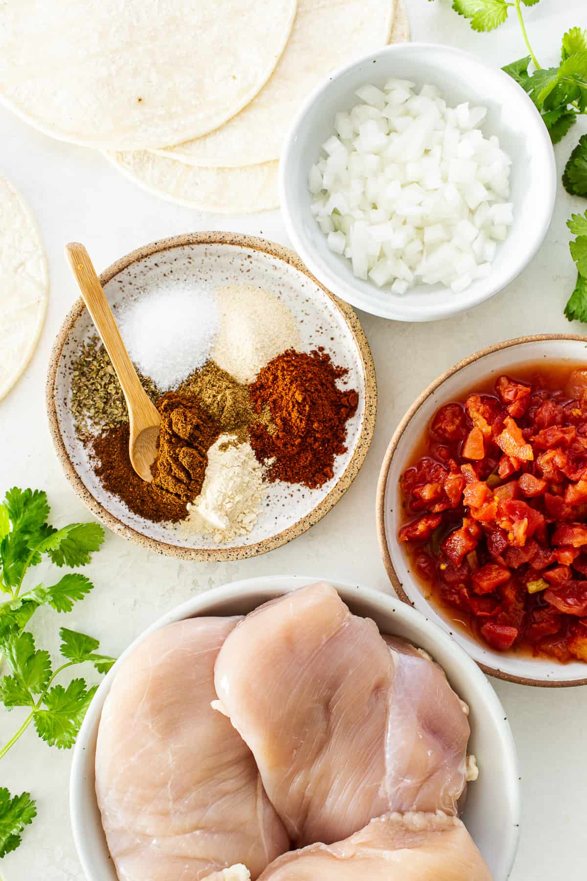 Ingredients for crockpot chicken tacos on a table.