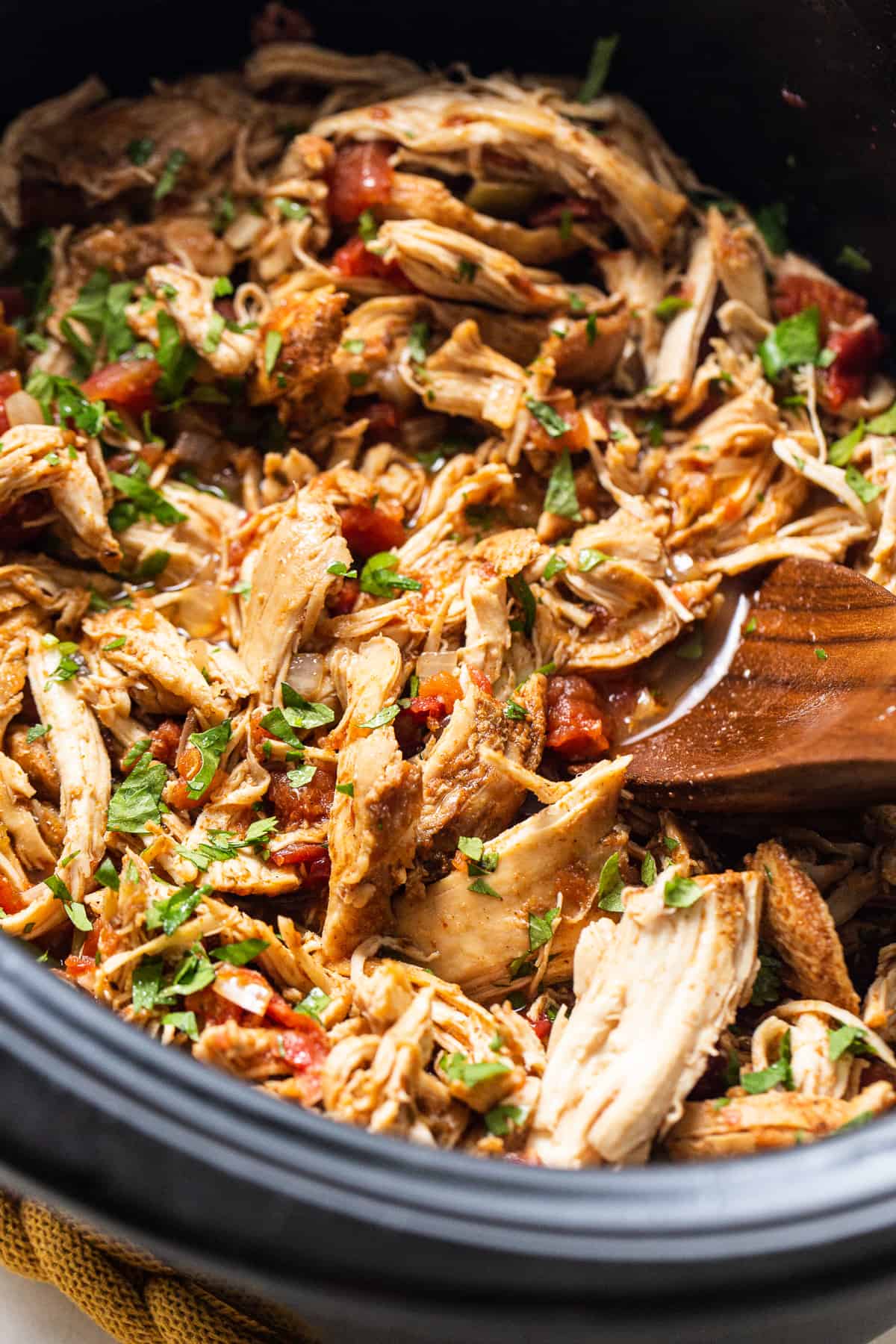 Crockpot chicken tacos in a slow cooker.