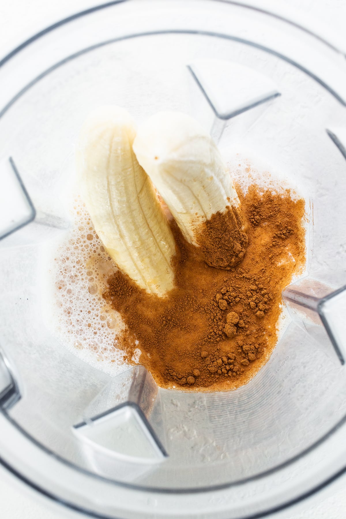 Milk, banana, and cinnamon in a blender