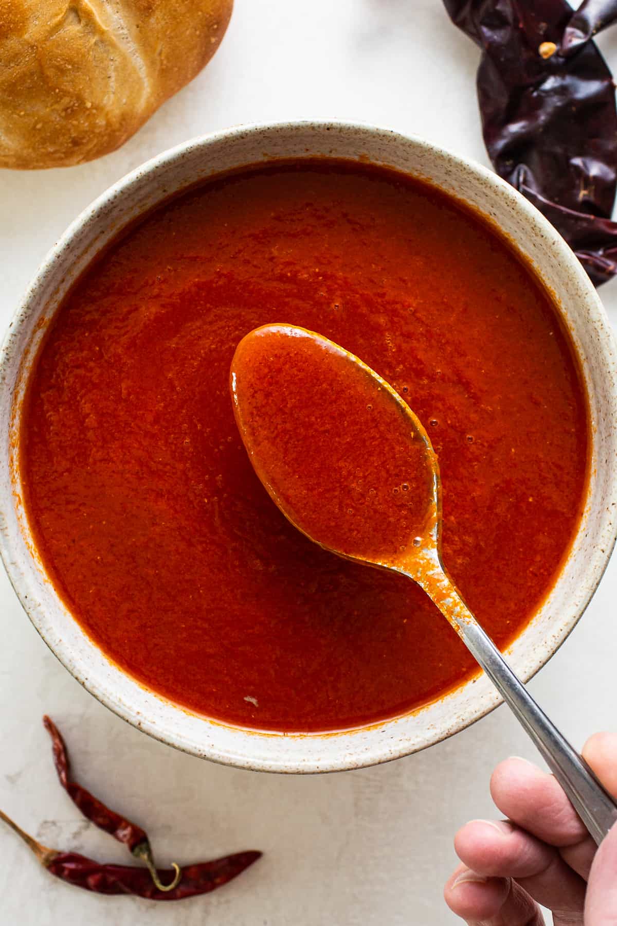 Red guajillo chile sauce in a bowl.