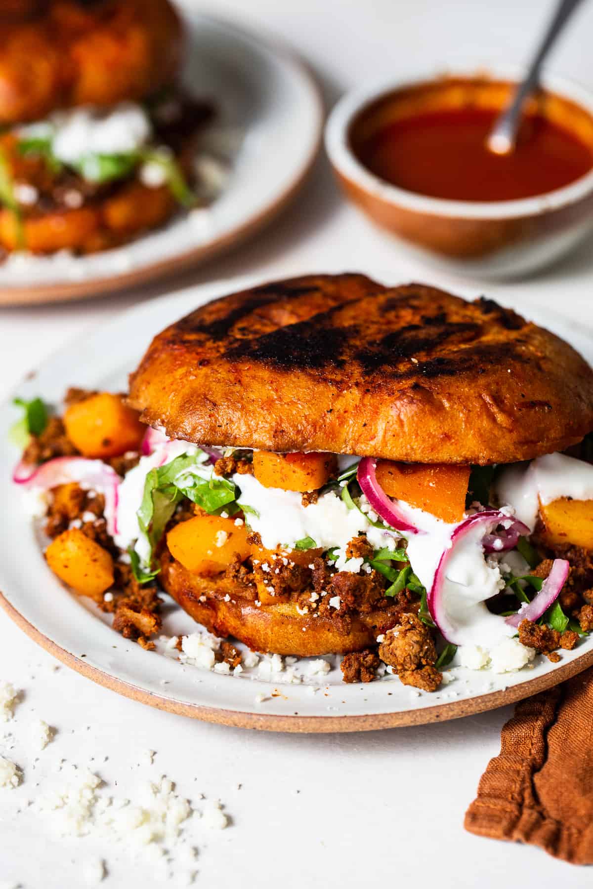 A Mexican pambazo sandwich on a plate ready to eat.