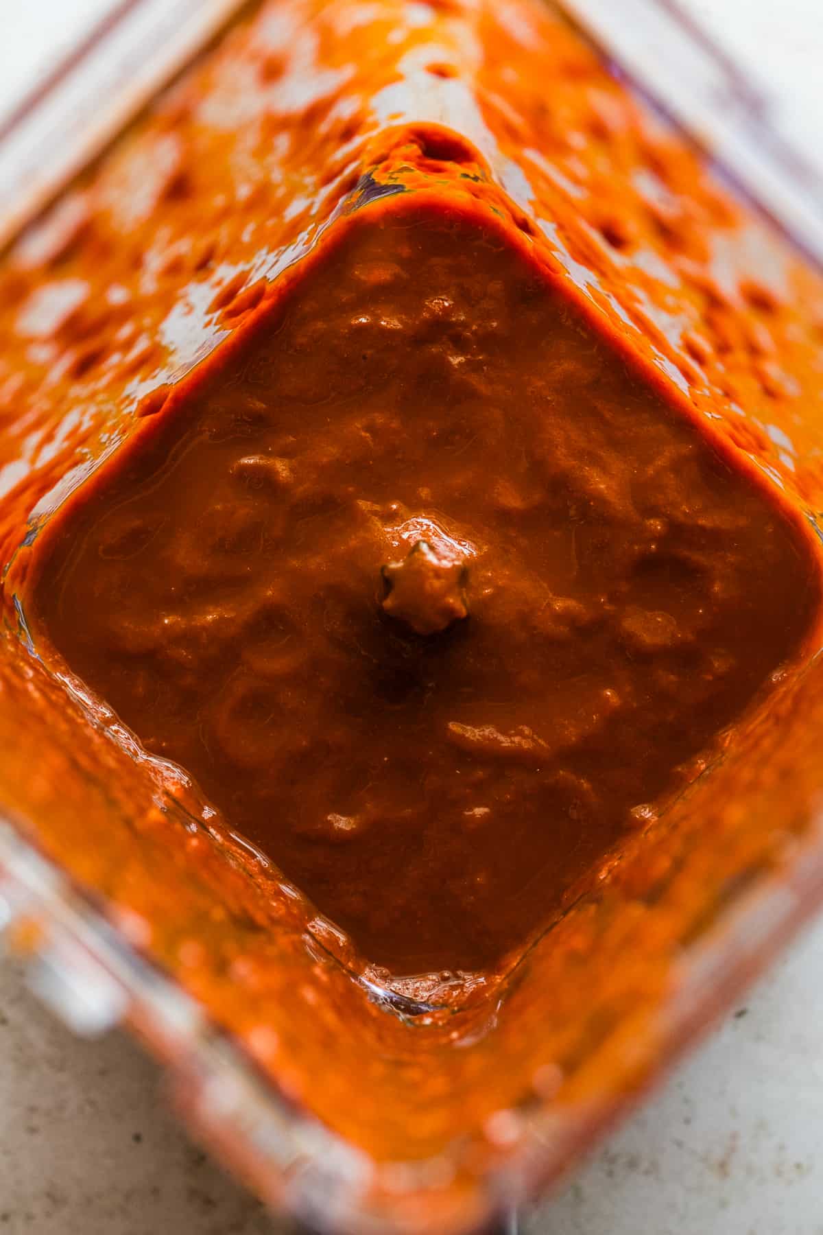 A chile rojo sauce in a blender.
