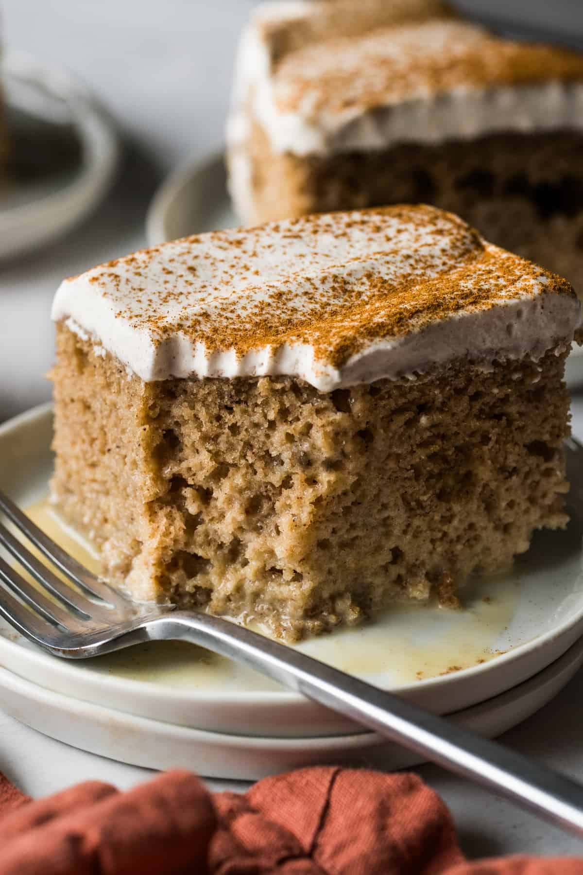 Apple tres leches cake on a plate.