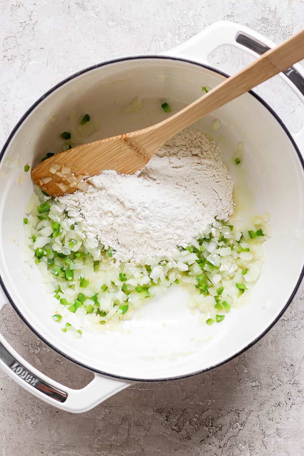 Masa harina in a pot with onions and peppers.