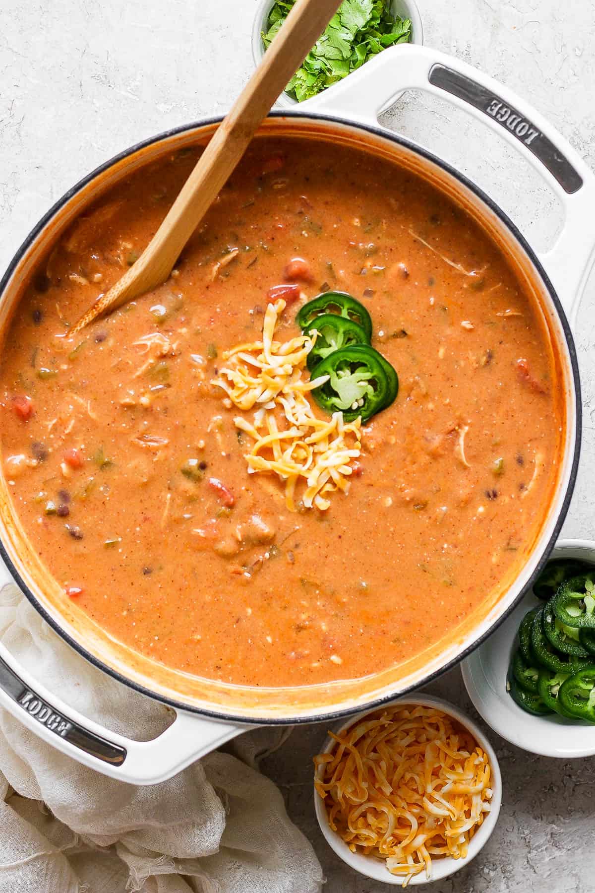 Chicken enchilada soup in a pot ready to eat.