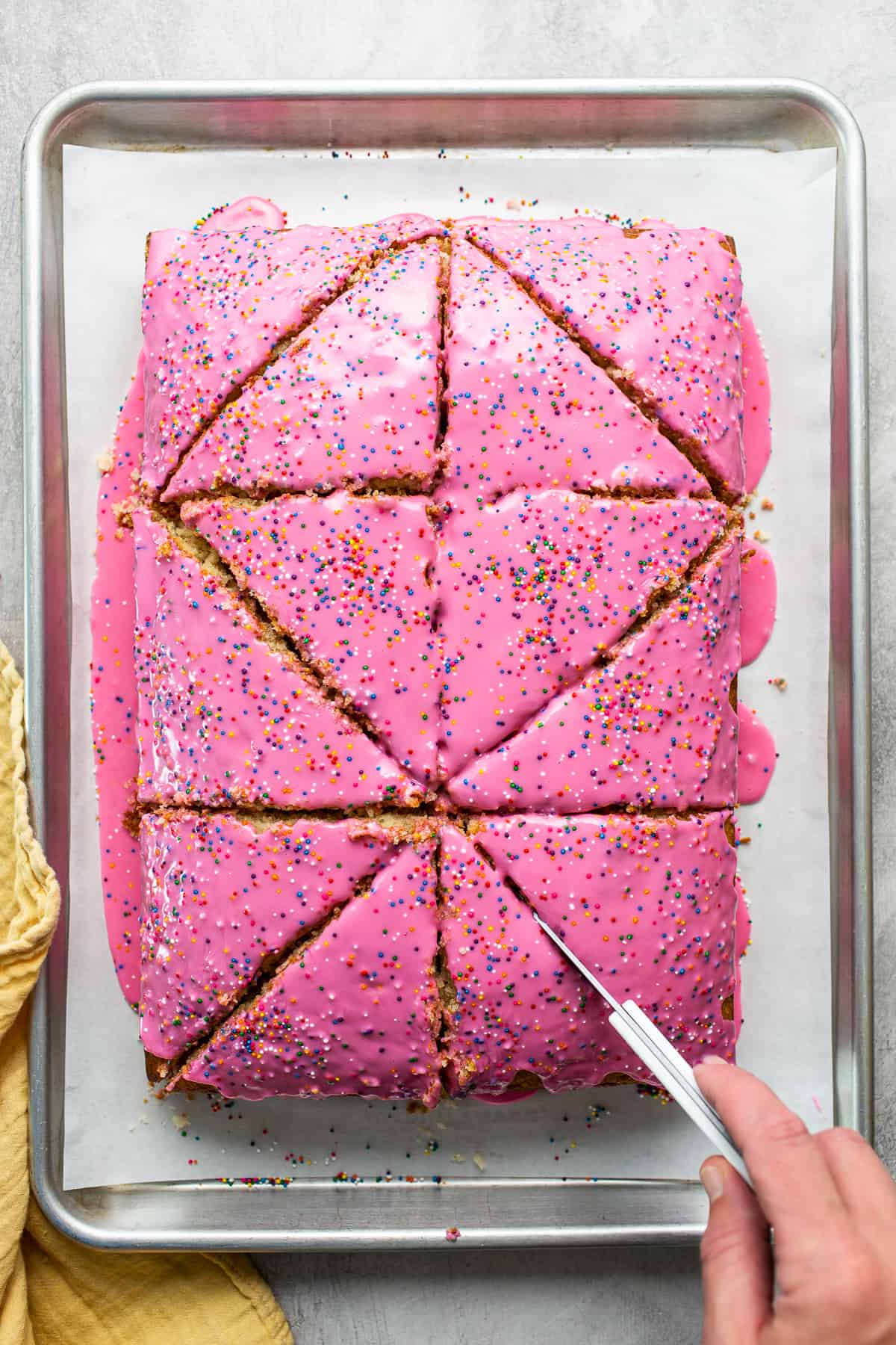 Cortadillo bread being sliced into large triangles.