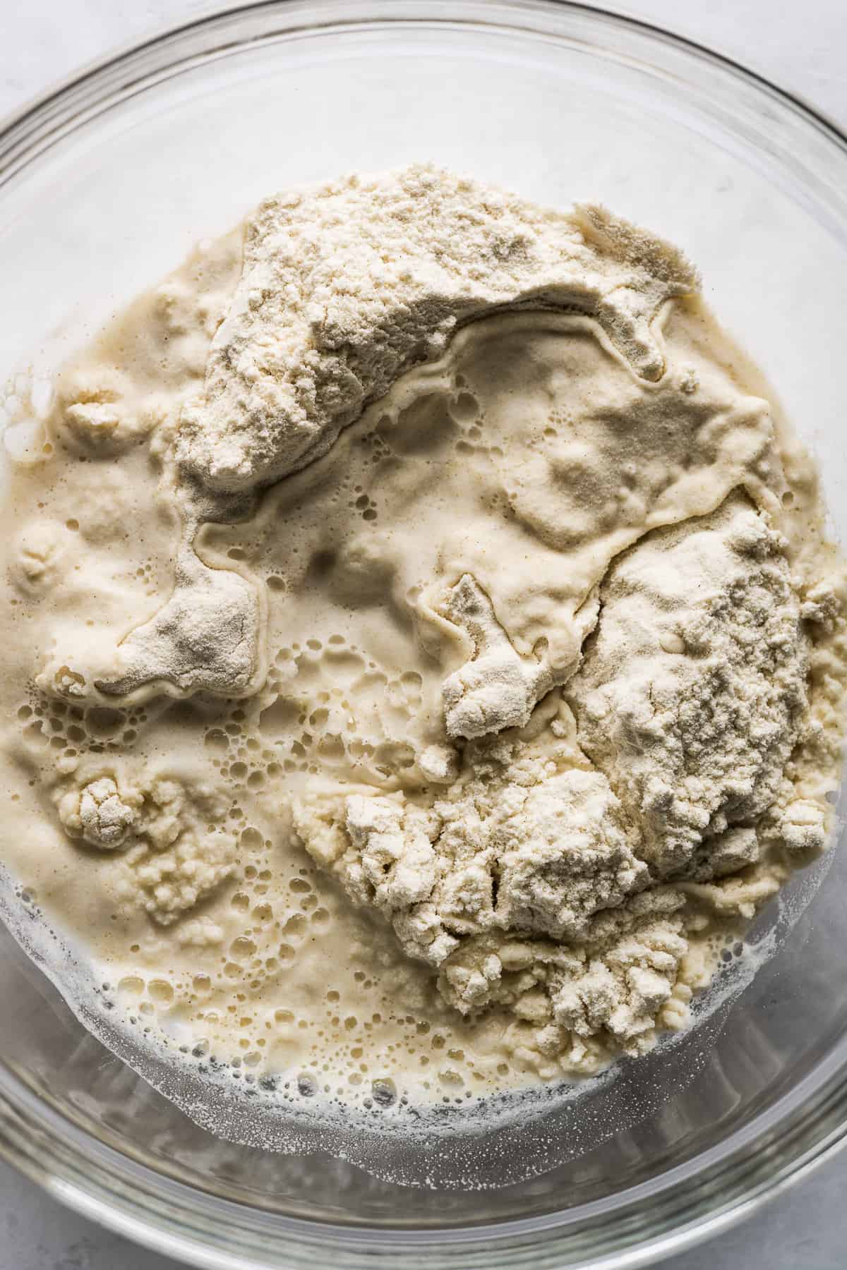 Masa harina, salt, and water in a bowl.