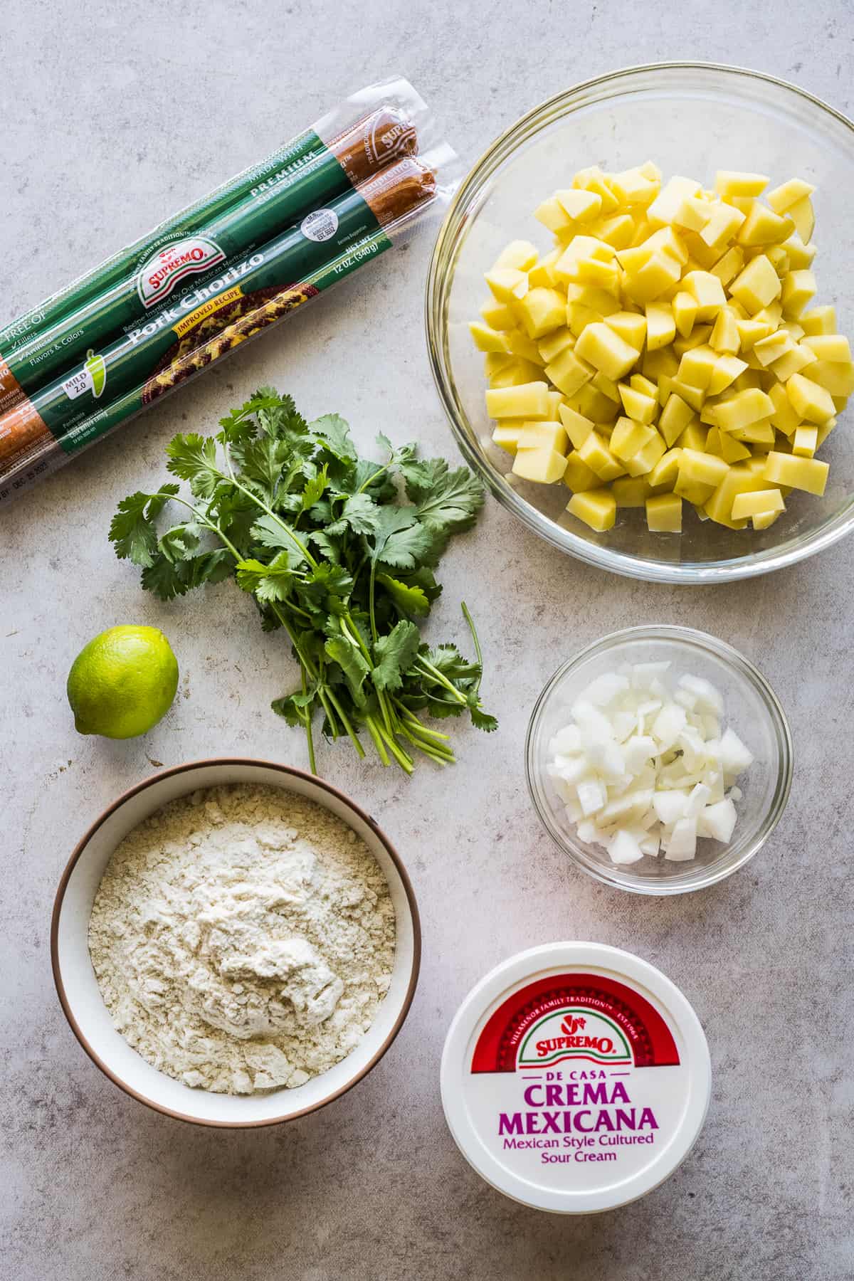 Ingredients for gorditas de papas con chorizo on a table.