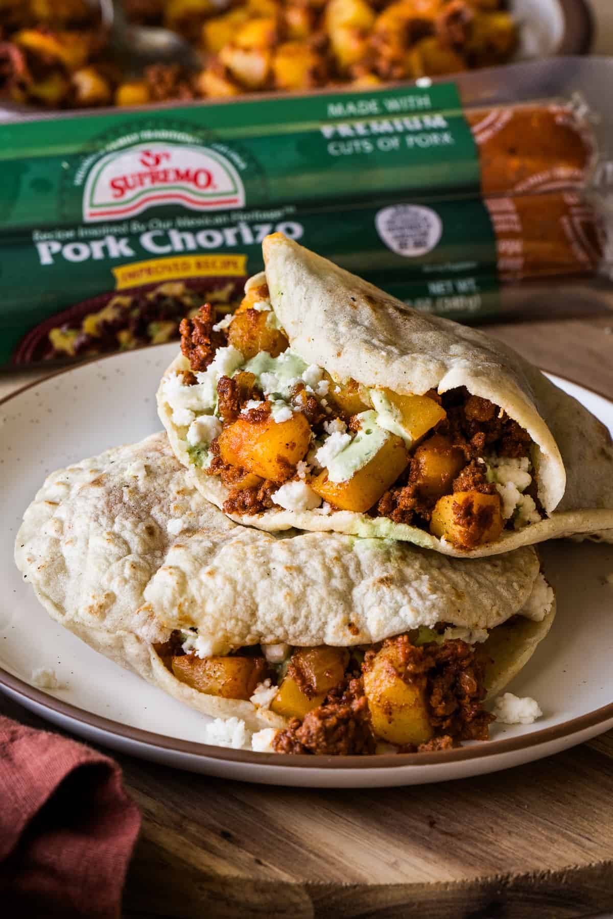 Gorditas filled with papas con chorizo on a plate.