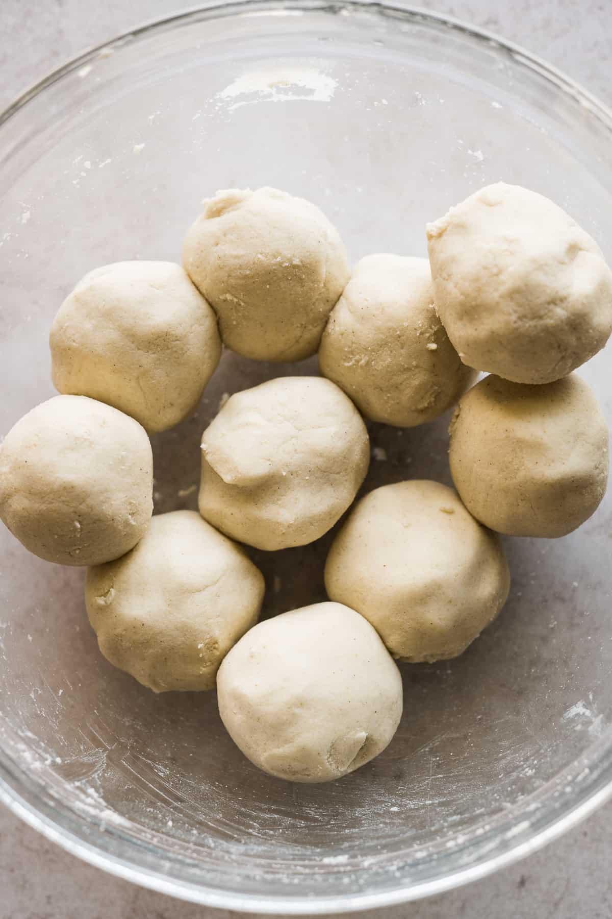 10 balls of masa harina dough in a bowl.