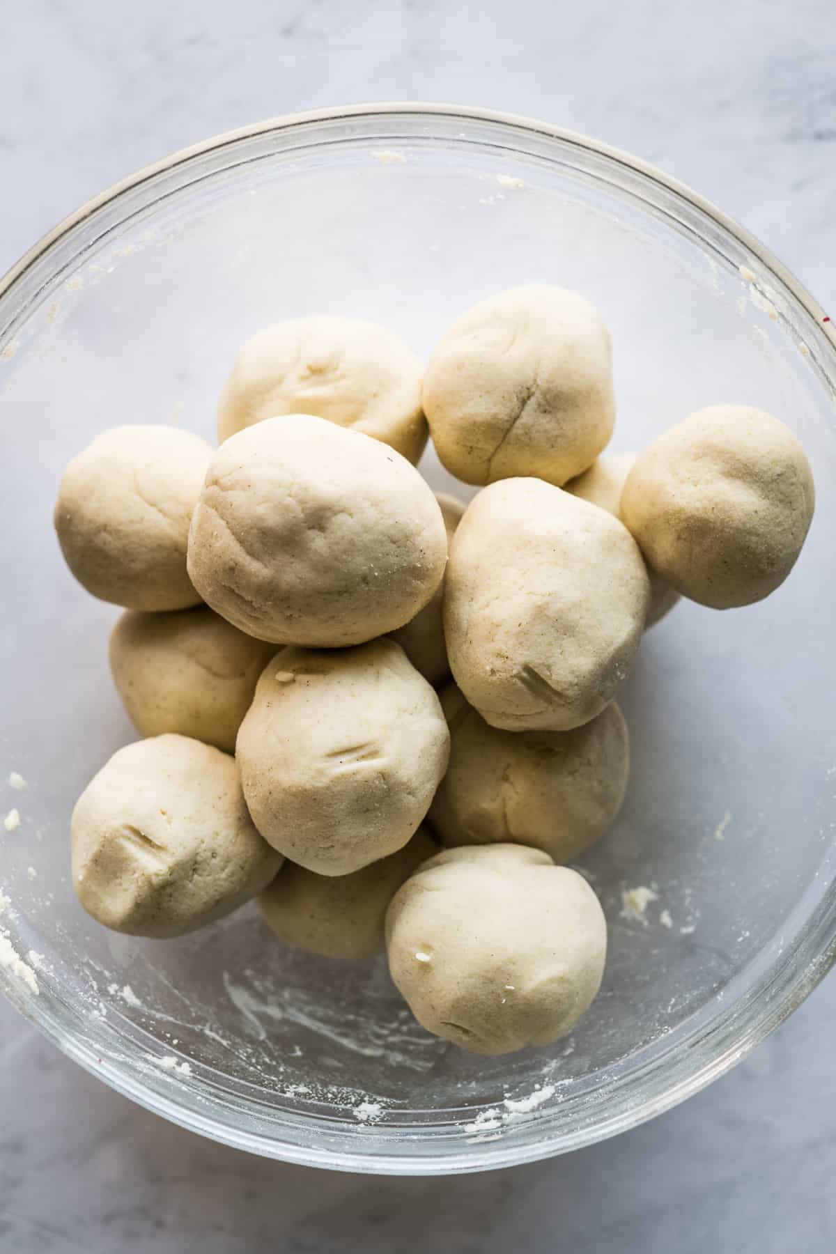 10 balls of prepared masa harina in a bowl.