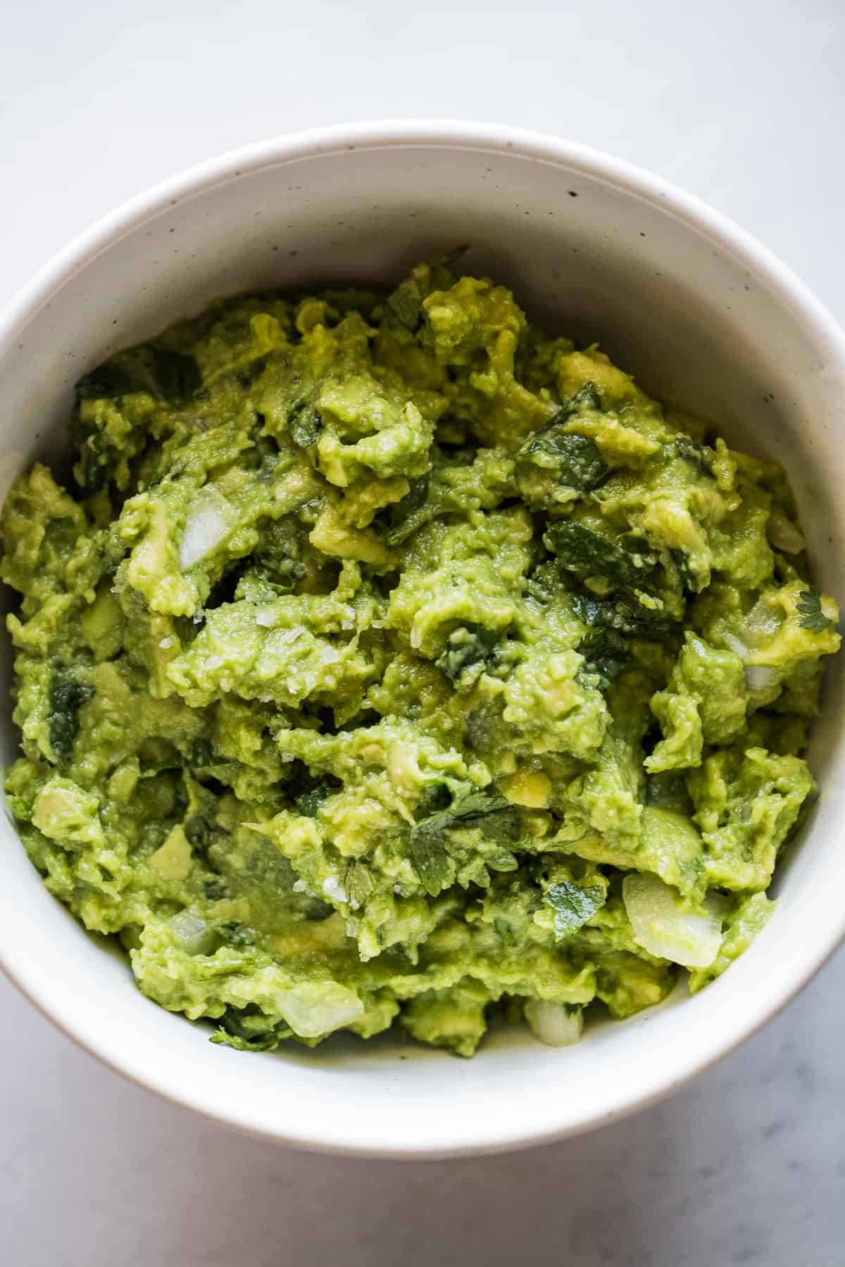 Guacamole in a bowl ready to be used as a filling in tortas.