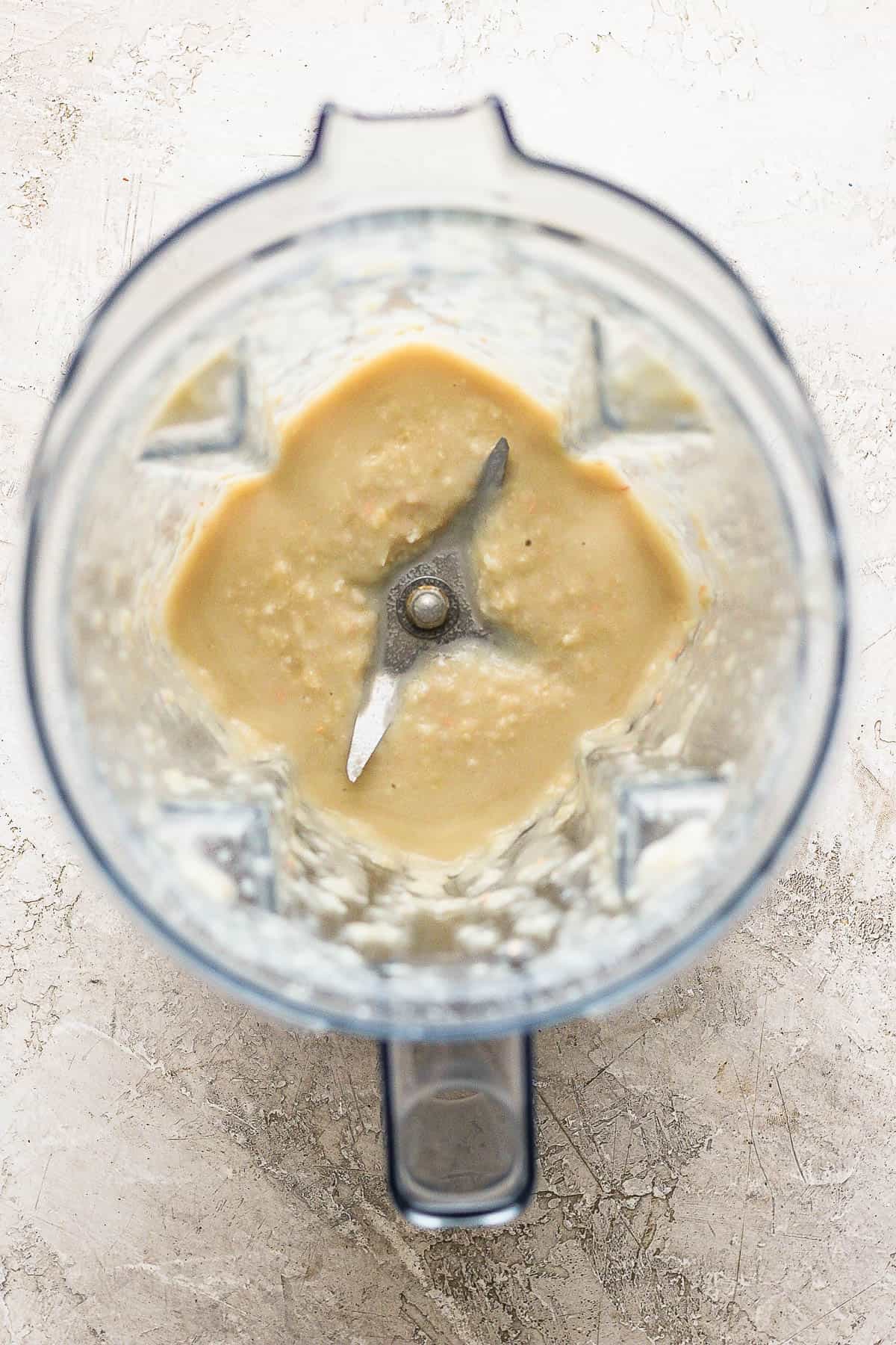 Blended cannellini beans and broth in a blender.