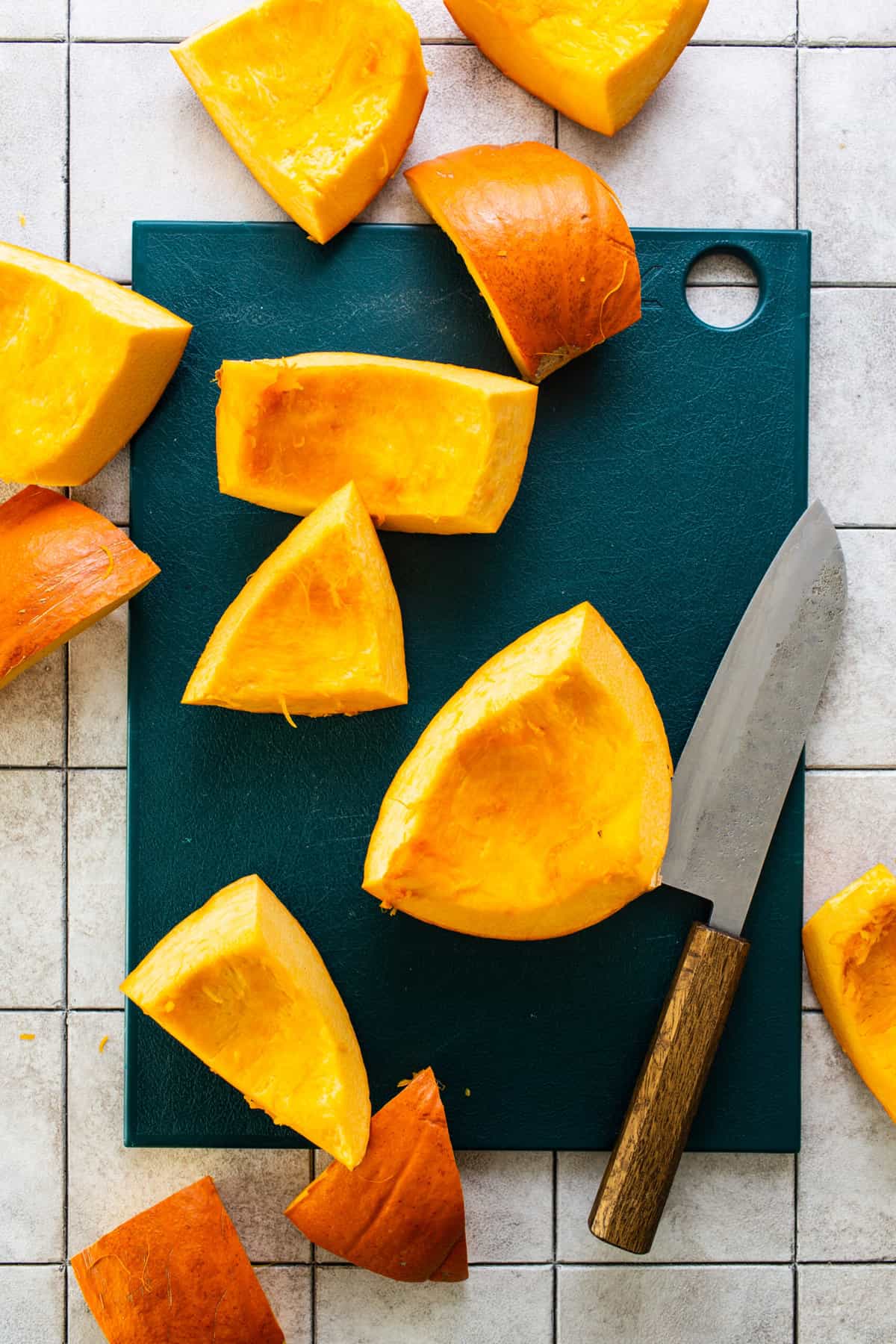 Sliced pumpkin on a cutting board.