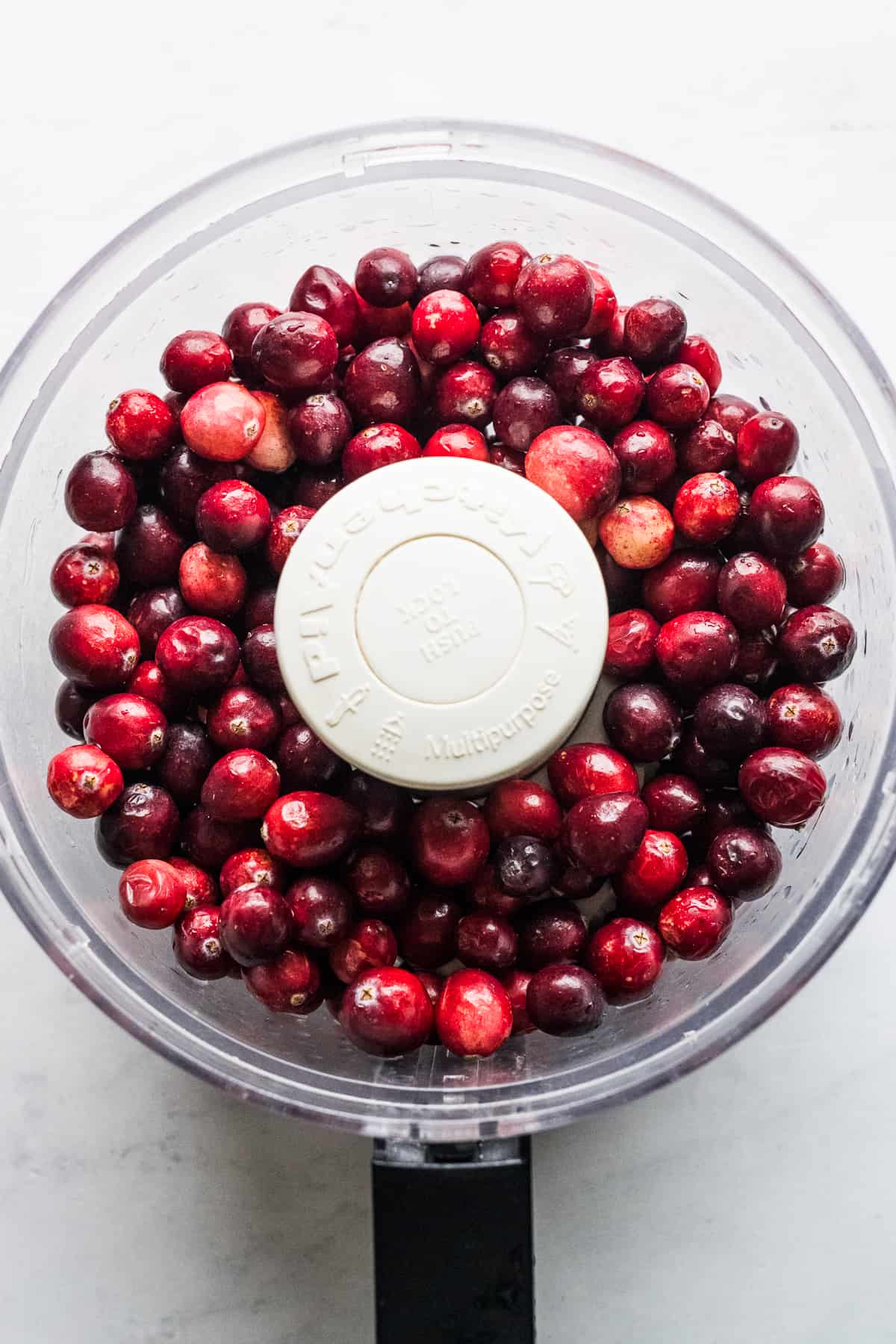 Fresh cranberries in a food processor.