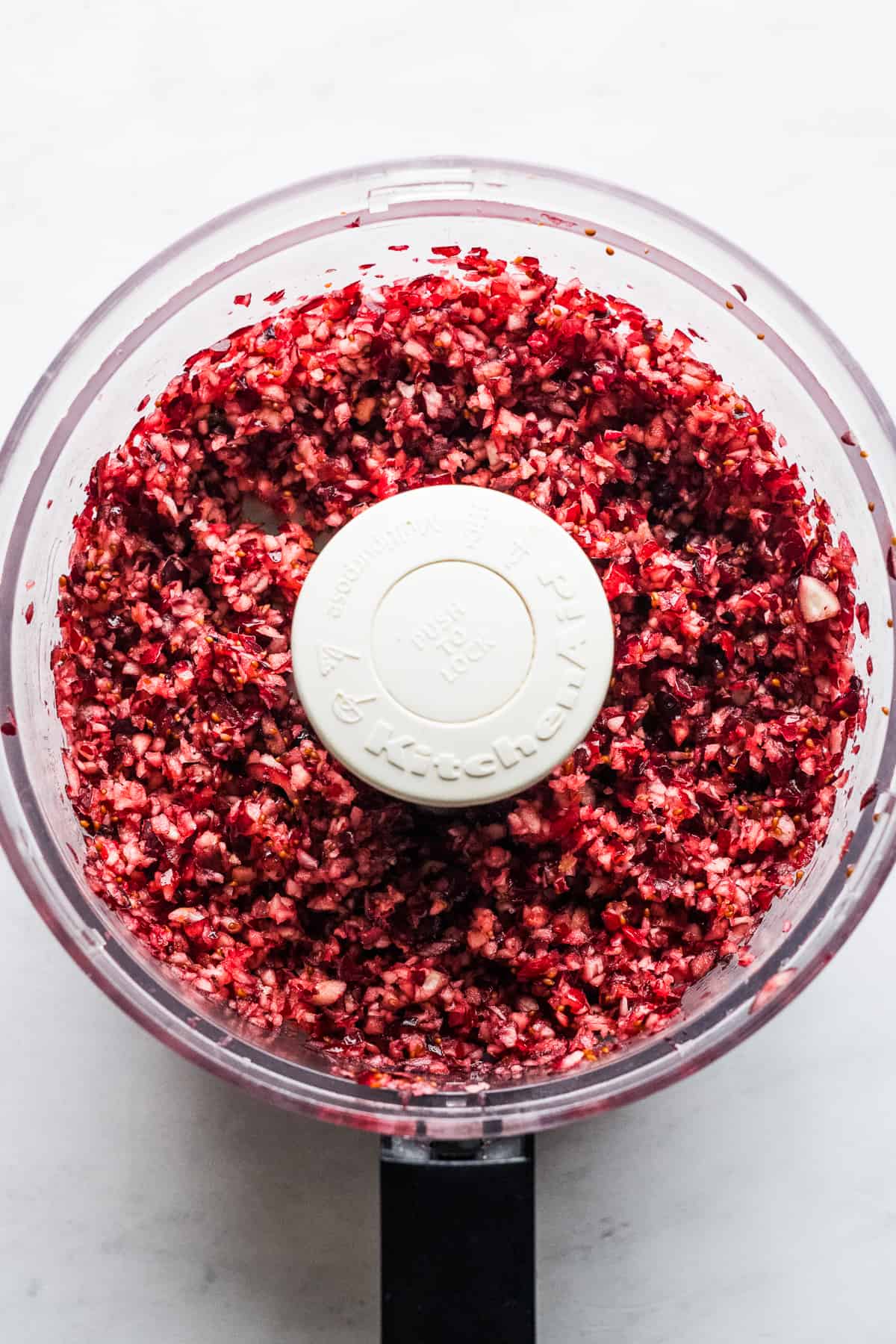 Finely chopped cranberries in a food processor.
