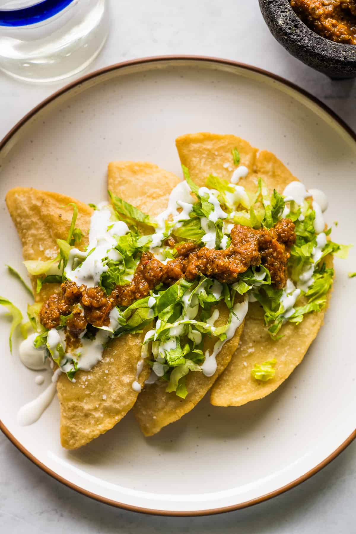 Fried quesadillas on a plate.