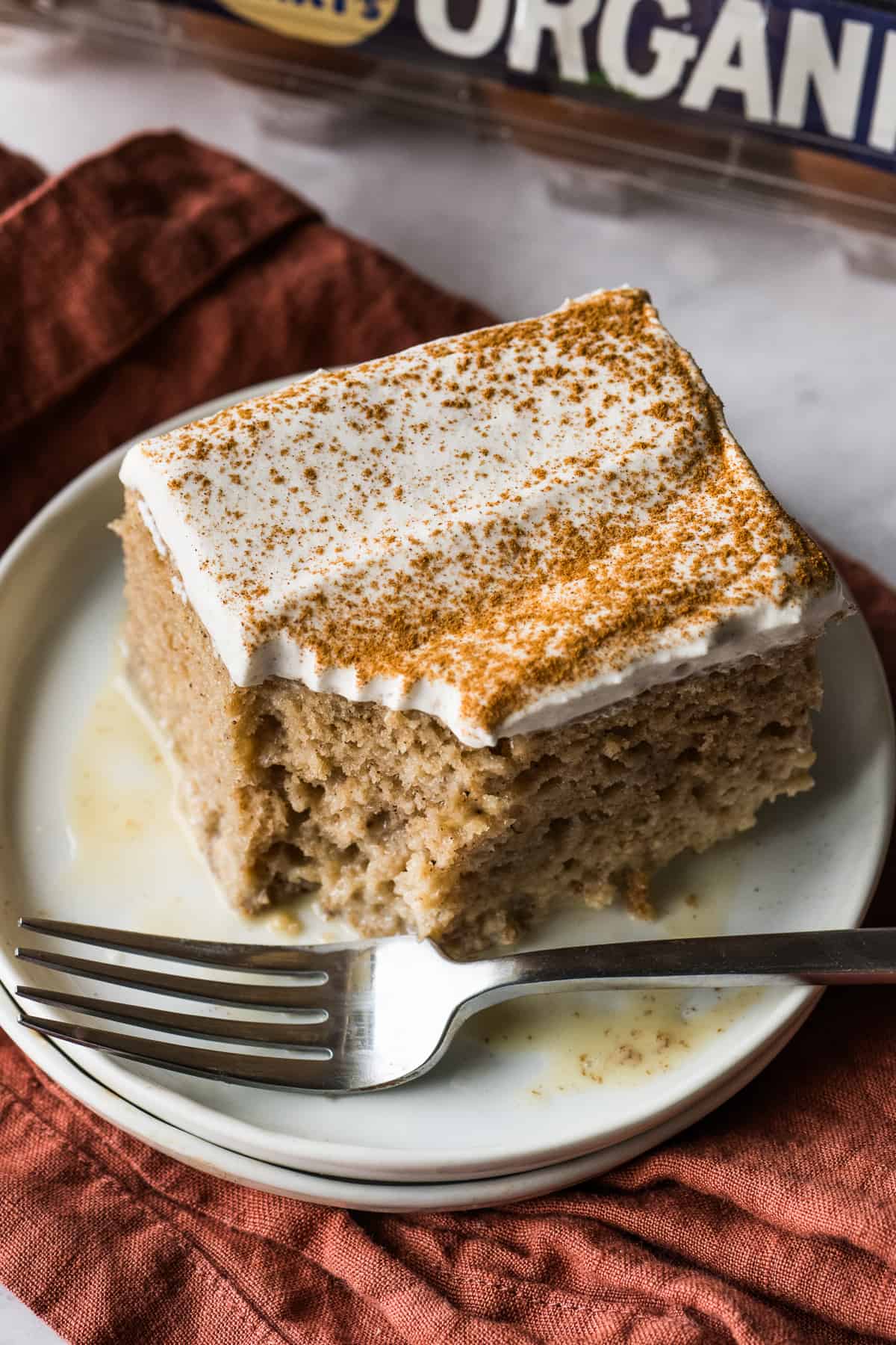 A piece of apple tres leches cake on a plate