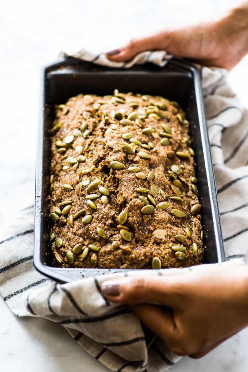 A loaf of pumpkin bread in a baking tin