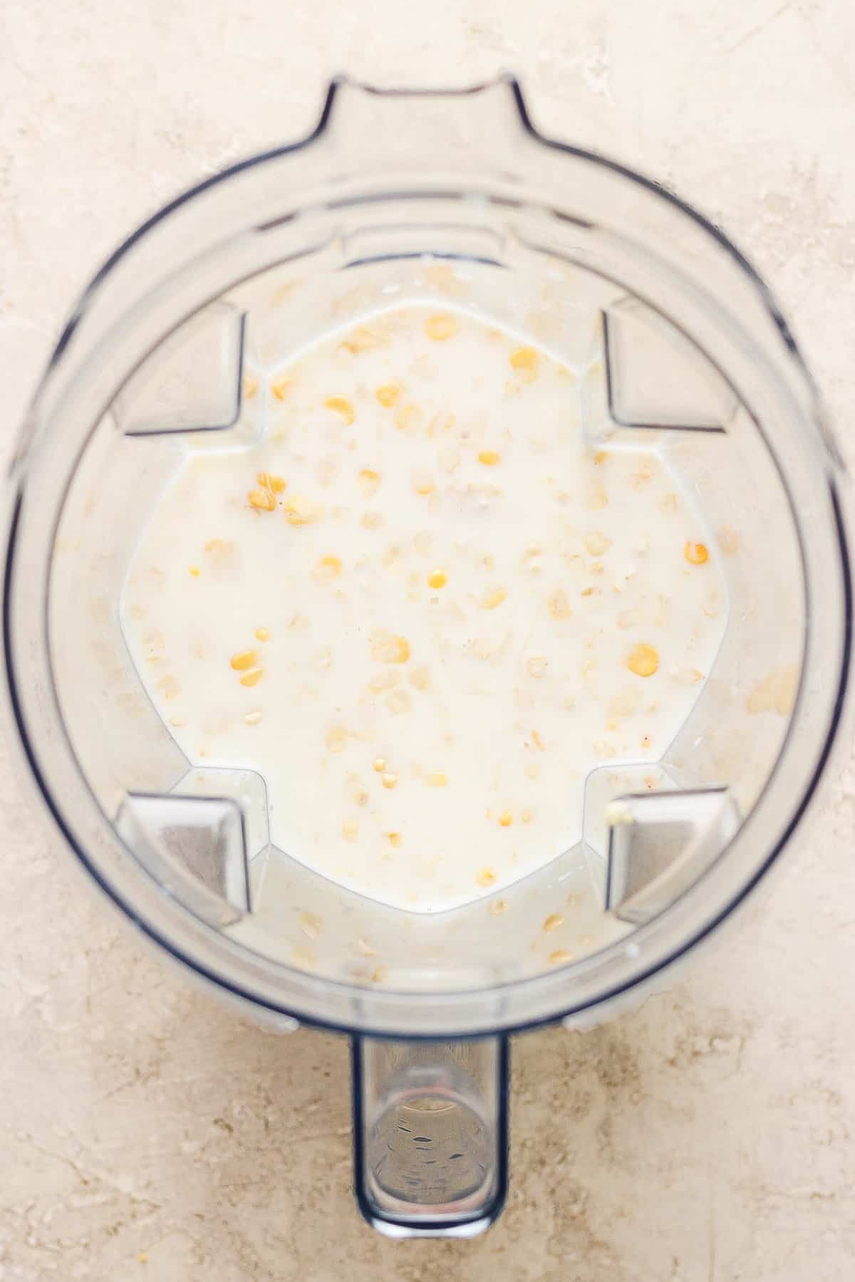 Milk and corn cut off the cob in a blender.