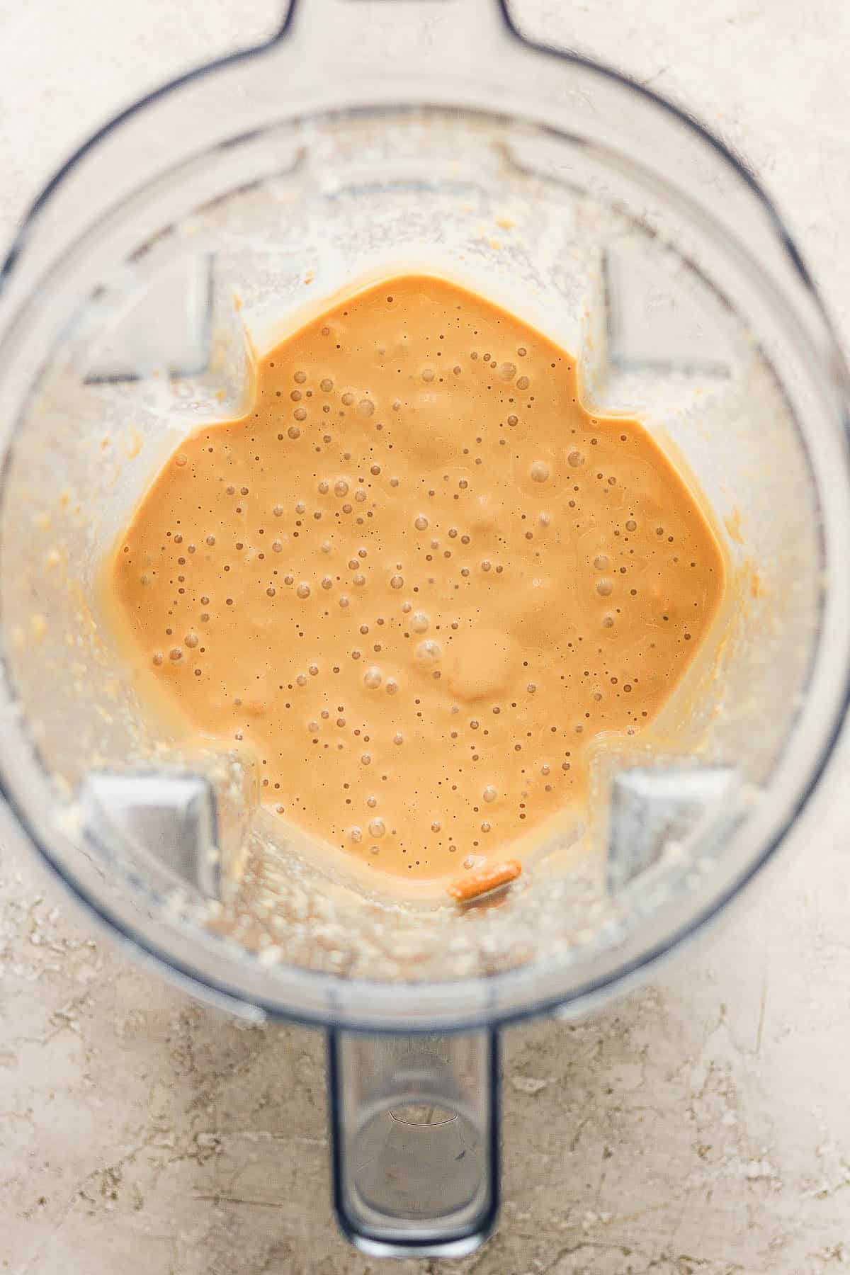 Blended galletas marias and evaporated milk in a blender.