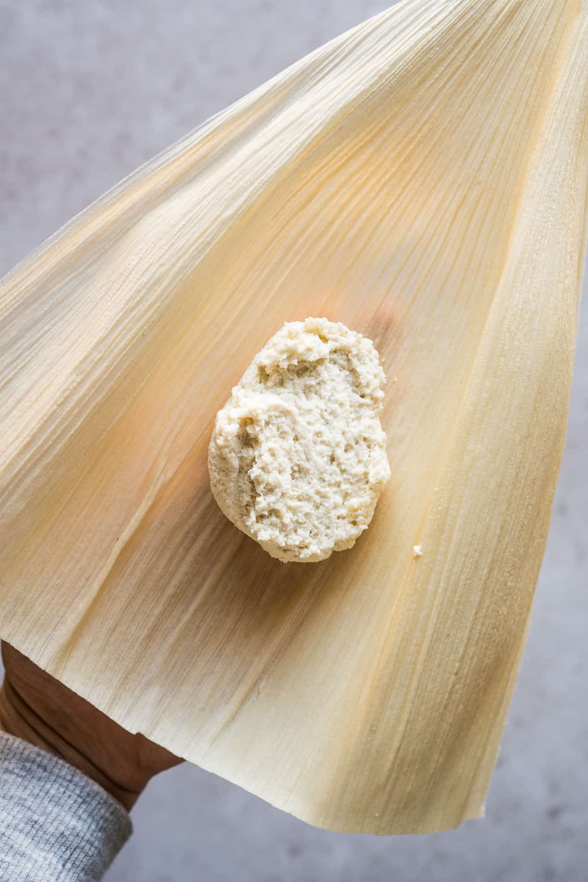 Masa for tamales on a corn husk.