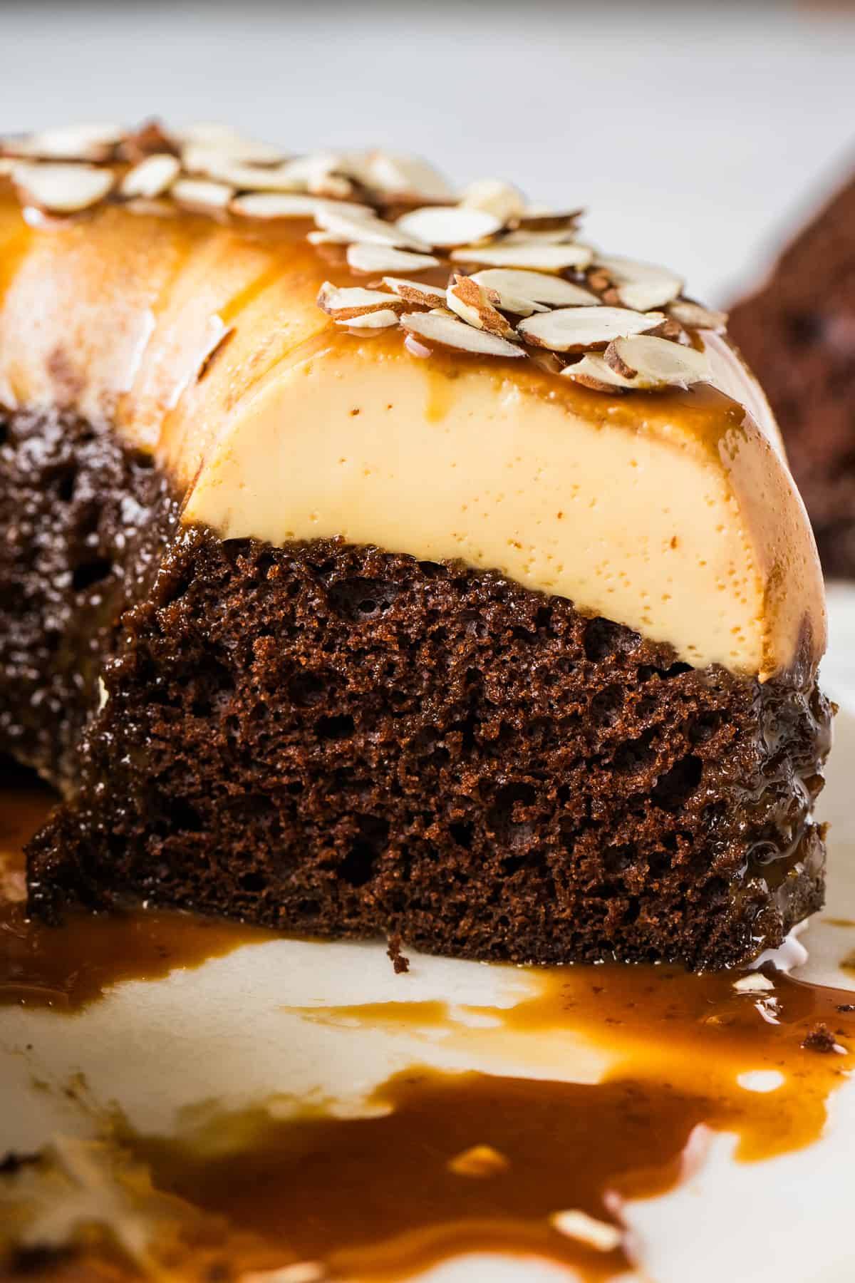 The inside of a chocoflan showing the distinct layers of chocolate cake and flan.