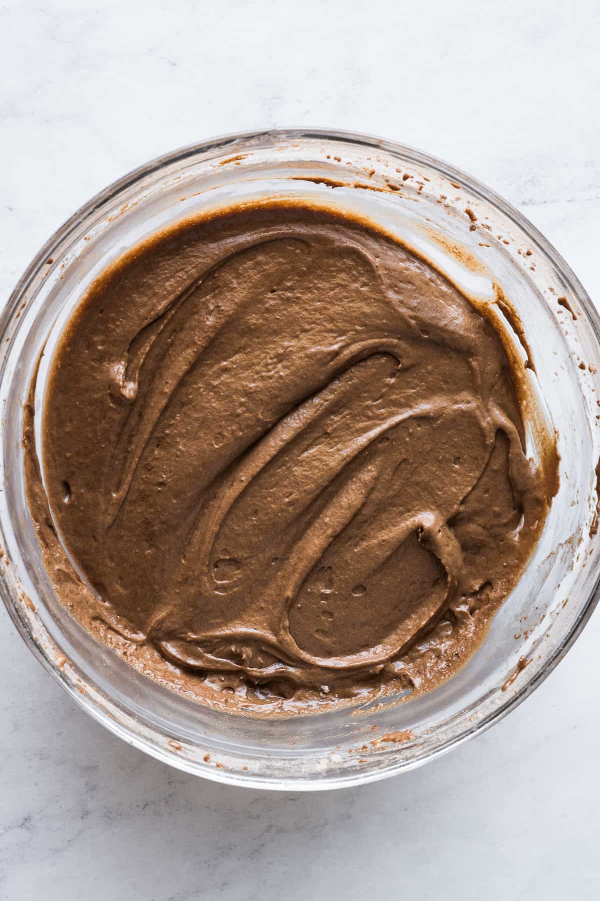 The chocolate cake batter for chocoflan in a large mixing bowl.