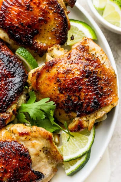 Cilantro Lime Chicken with a golden crispy skin on a plate.
