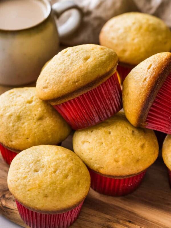 Mantecadas on a table with a red muffin cupcake liner.